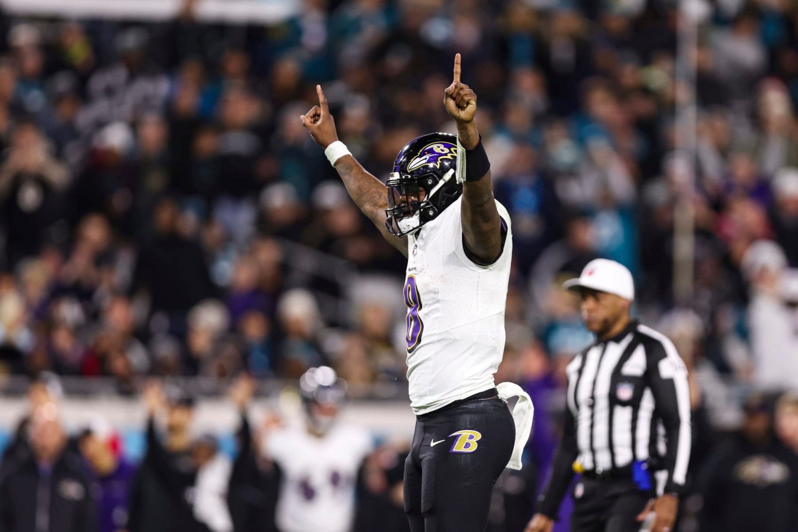 JACKSONVILLE, FL - DECEMBER 17: Lamar Jackson #8 of the Baltimore Ravens celebrates during an NFL football game against the Jacksonville Jaguars at EverBank Stadium on December 17, 2023 in Jacksonville, Florida. (Photo by Perry Knotts/Getty Images)