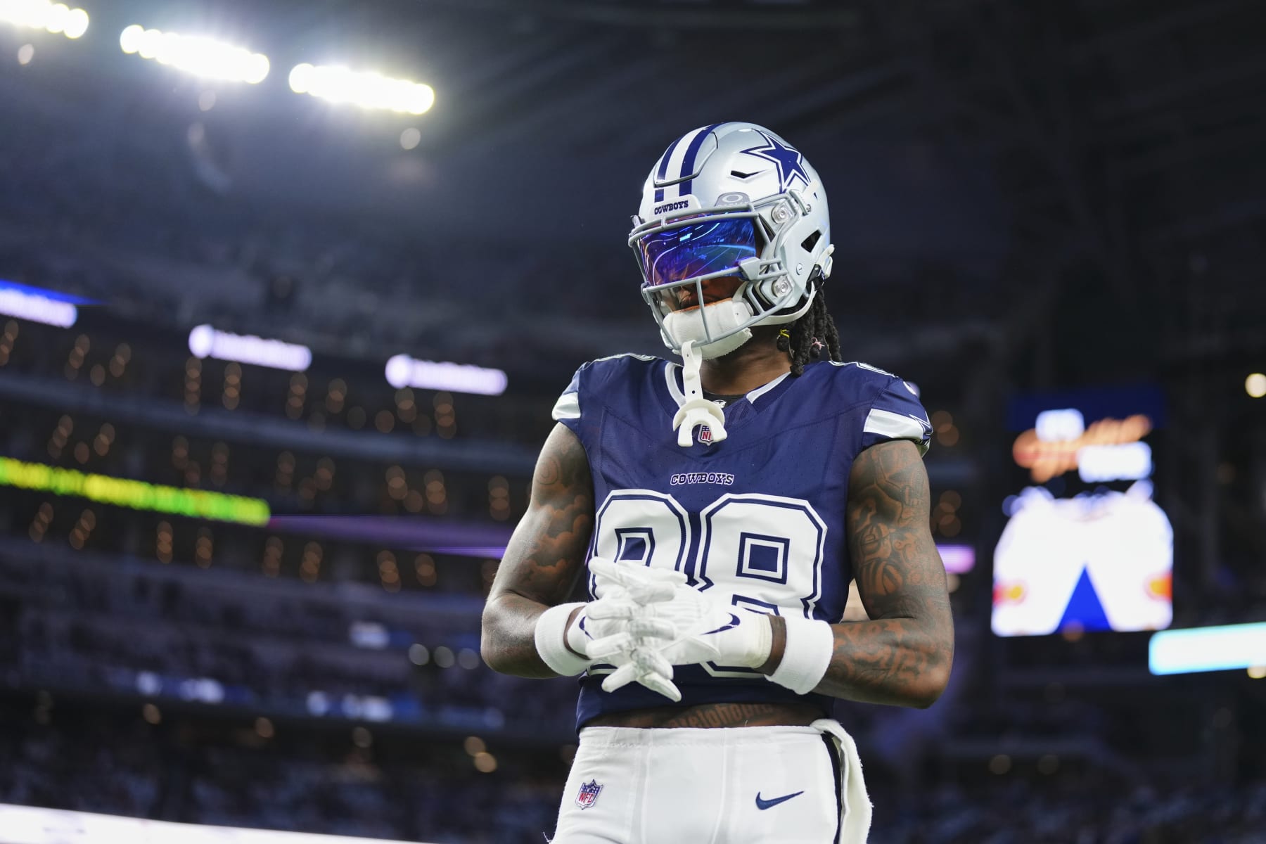 ARLINGTON, TX - DECEMBER 30: CeeDee Lamb #88 of the Dallas Cowboys warms up before kickoff against the Detroit Lions at AT&T Stadium on December 30, 2023 in Arlington, Texas. (Photo by Cooper Neill/Getty Images)
