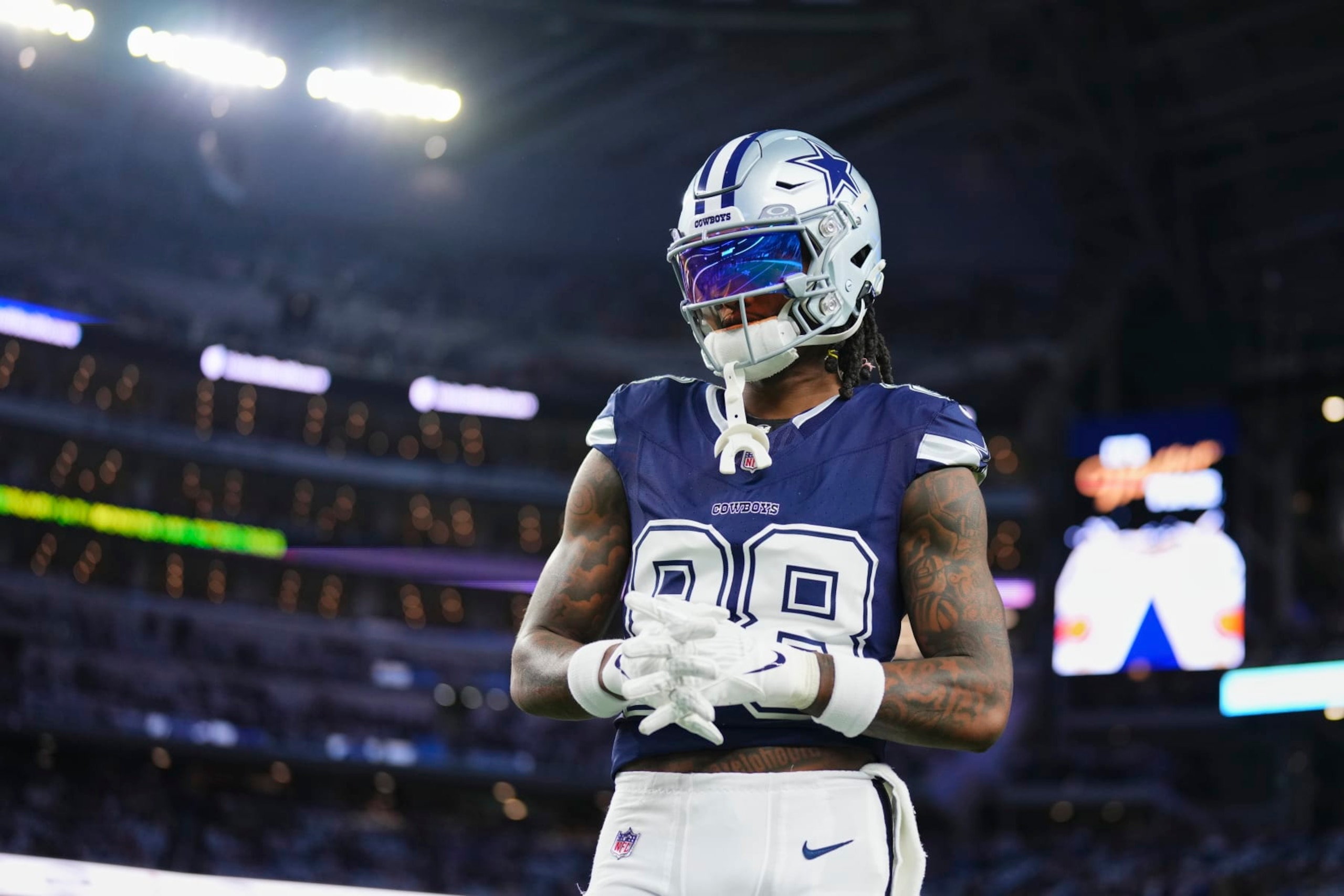 ARLINGTON, TX - DECEMBER 30: CeeDee Lamb #88 of the Dallas Cowboys warms up before kickoff against the Detroit Lions at AT&T Stadium on December 30, 2023 in Arlington, Texas. (Photo by Cooper Neill/Getty Images)