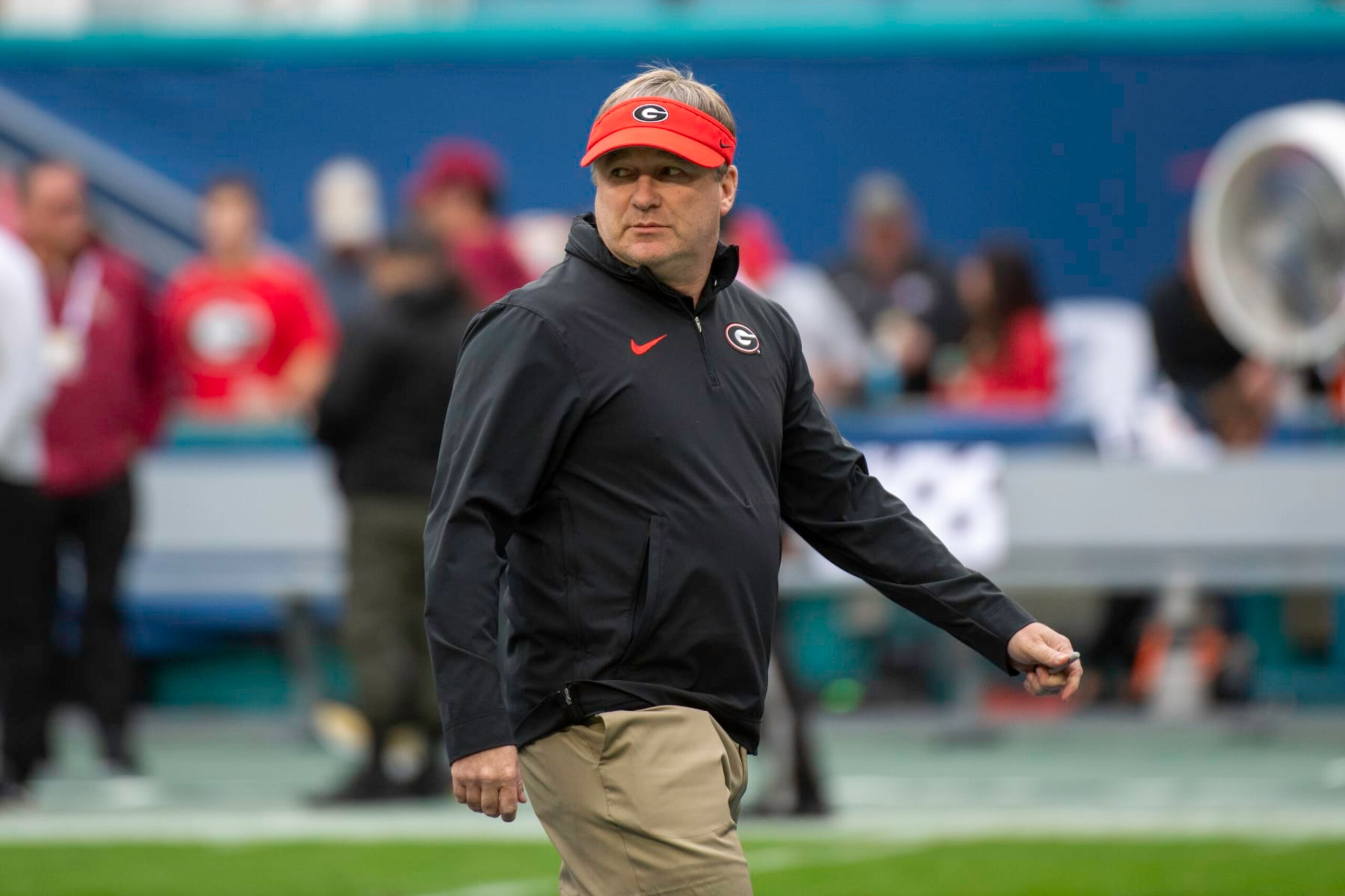 MIAMI GARDENS, FL - DECEMBER 30: Georgia head coach Kirby Smart watches the players warm up on the field before the Capital One Orange Bowl college football game between the Georgia Bulldogs and the Florida State Seminoles on December 30, 2023 at the Hard Rock Stadium in Miami Gardens, FL. (Photo by Doug Murray/Icon Sportswire via Getty Images)