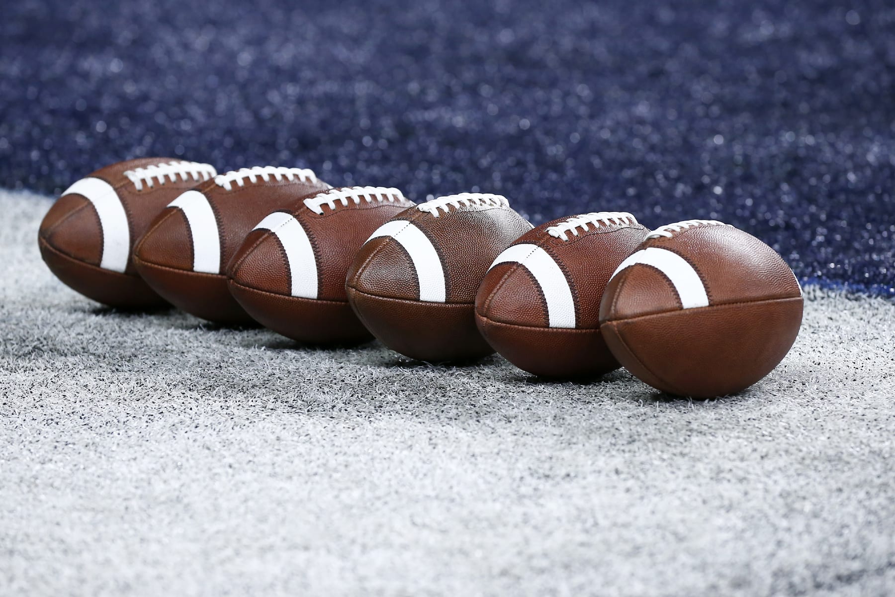 INDIANAPOLIS, IN - DECEMBER 02: Several footballs sit on the sideline prior to the start of the Big Ten Championship Game between the Michigan Wolverines and the Iowa Hawkeyes on December 02, 2023 at Lucas Oil Stadium in Indianapolis,IN.  (Photo by Jeffrey Brown/Icon Sportswire via Getty Images)