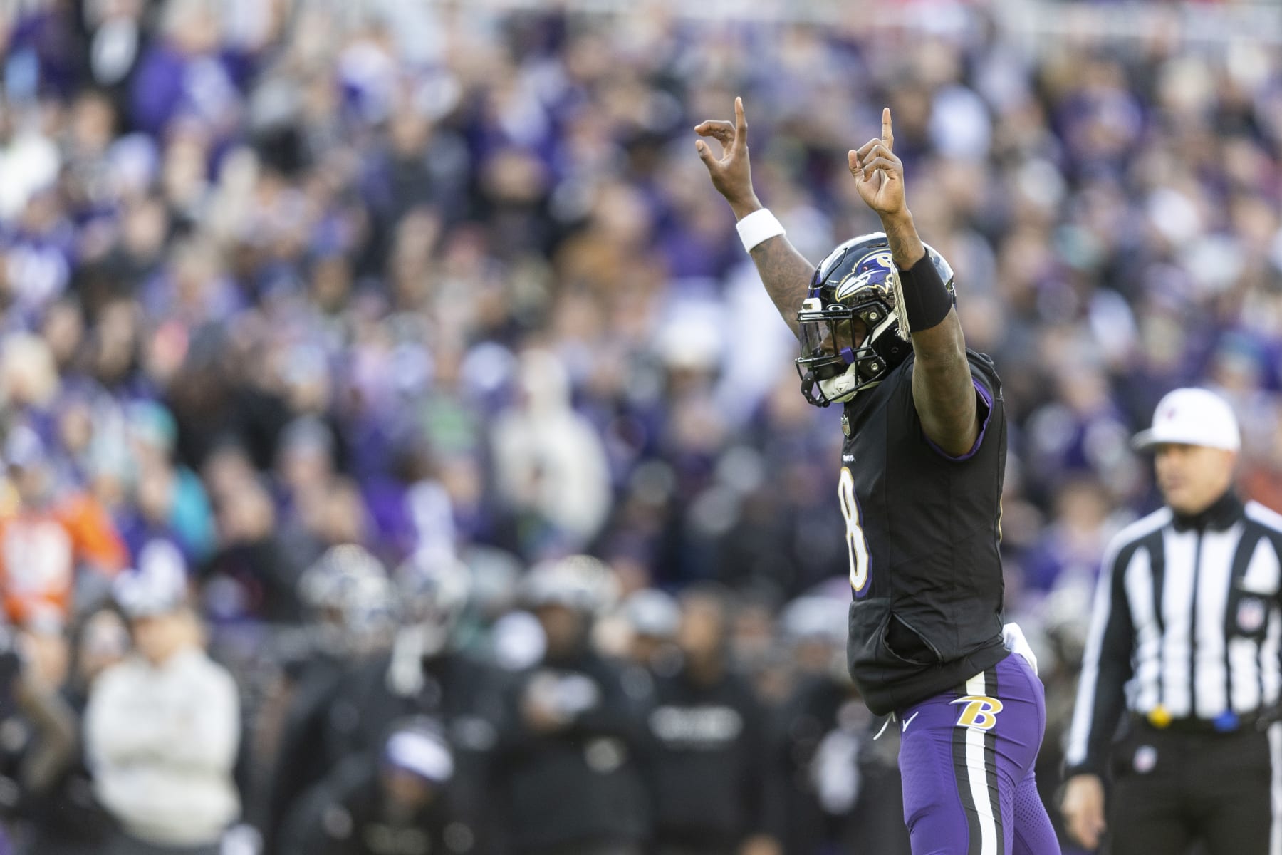 BALTIMORE, MARYLAND - DECEMBER 31: Lamar Jackson #8 of the Baltimore Ravens celebrates after a touchdown during an NFL football game between the Baltimore Ravens and the Miami Dolphins at M&T Bank Stadium on December 31, 2023 in Baltimore, Maryland. (Photo by Michael Owens/Getty Images)
