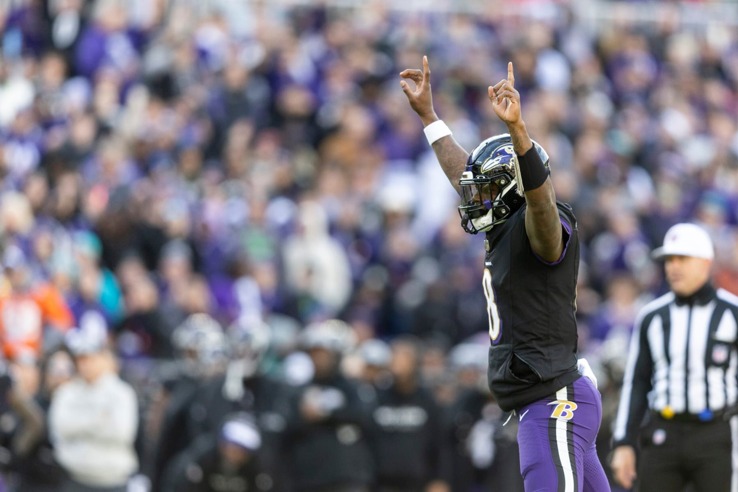 BALTIMORE, MARYLAND - DECEMBER 31: Lamar Jackson #8 of the Baltimore Ravens celebrates after a touchdown during an NFL football game between the Baltimore Ravens and the Miami Dolphins at M&T Bank Stadium on December 31, 2023 in Baltimore, Maryland. (Photo by Michael Owens/Getty Images)