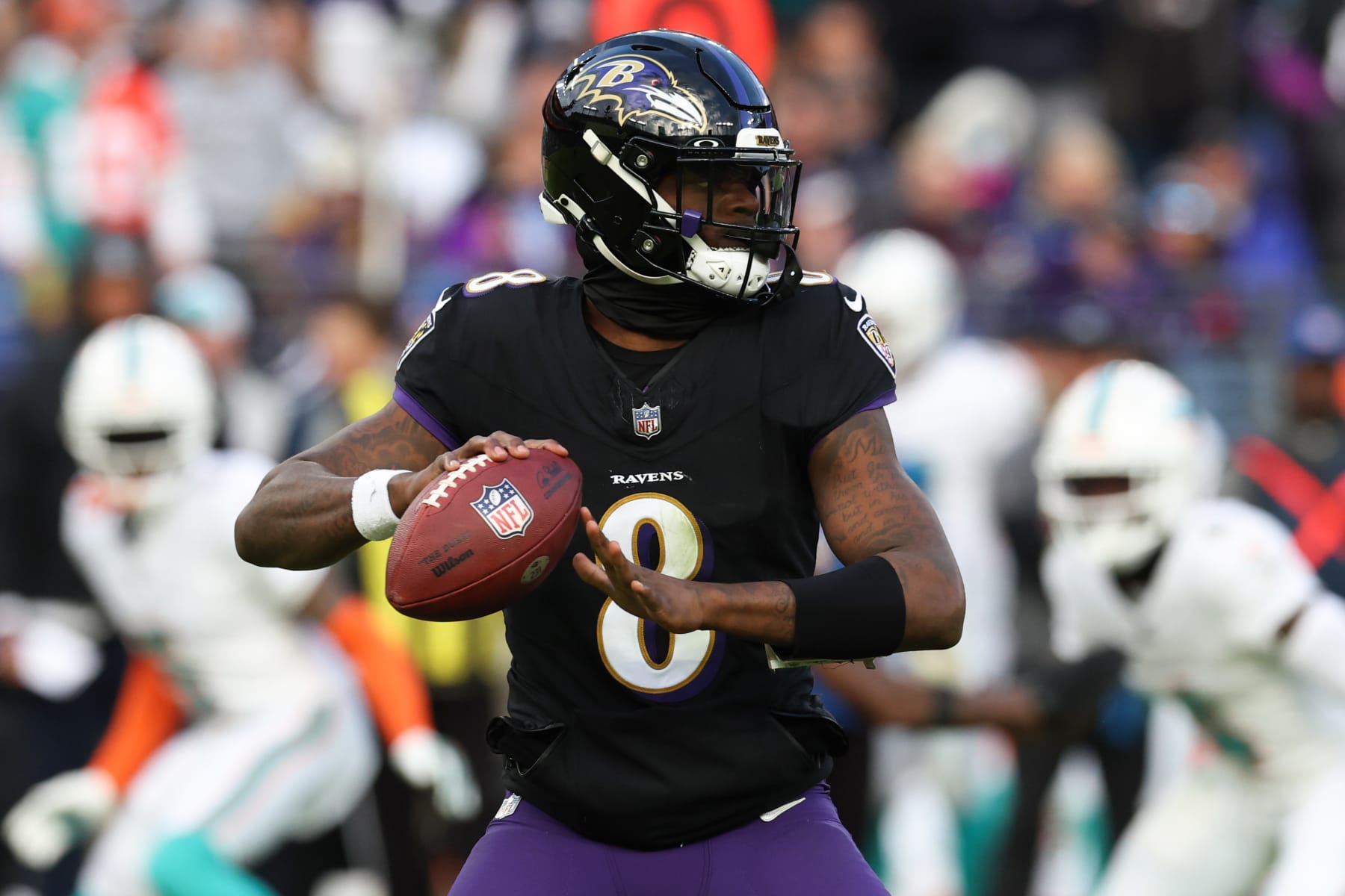 BALTIMORE, MARYLAND - DECEMBER 31: Lamar Jackson #8 of the Baltimore Ravens throws a pass against the Miami Dolphins during the second half of the game at M&T Bank Stadium on December 31, 2023 in Baltimore, Maryland. (Photo by Todd Olszewski/Getty Images)
