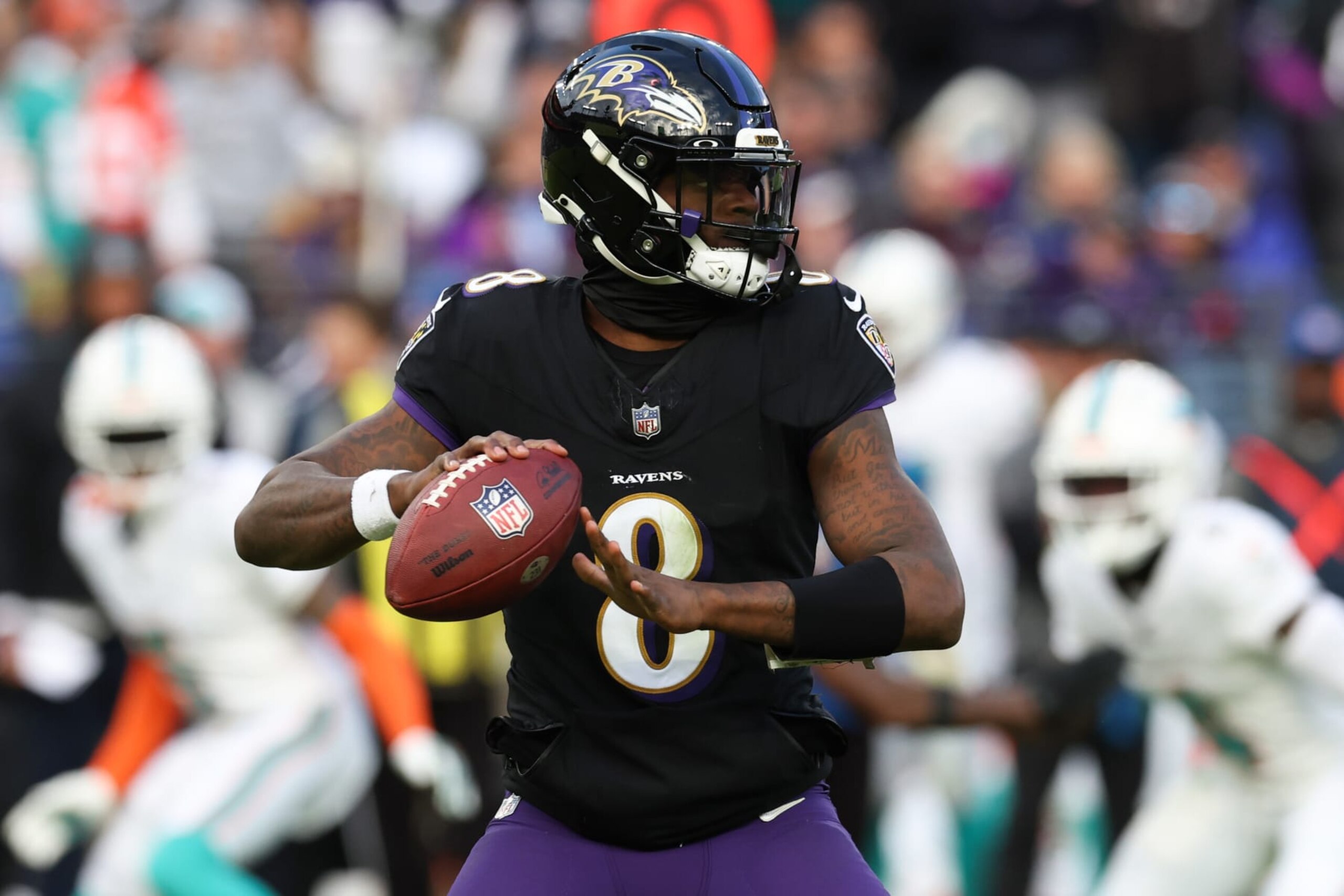 BALTIMORE, MARYLAND - DECEMBER 31: Lamar Jackson #8 of the Baltimore Ravens throws a pass against the Miami Dolphins during the second half of the game at M&T Bank Stadium on December 31, 2023 in Baltimore, Maryland. (Photo by Todd Olszewski/Getty Images)