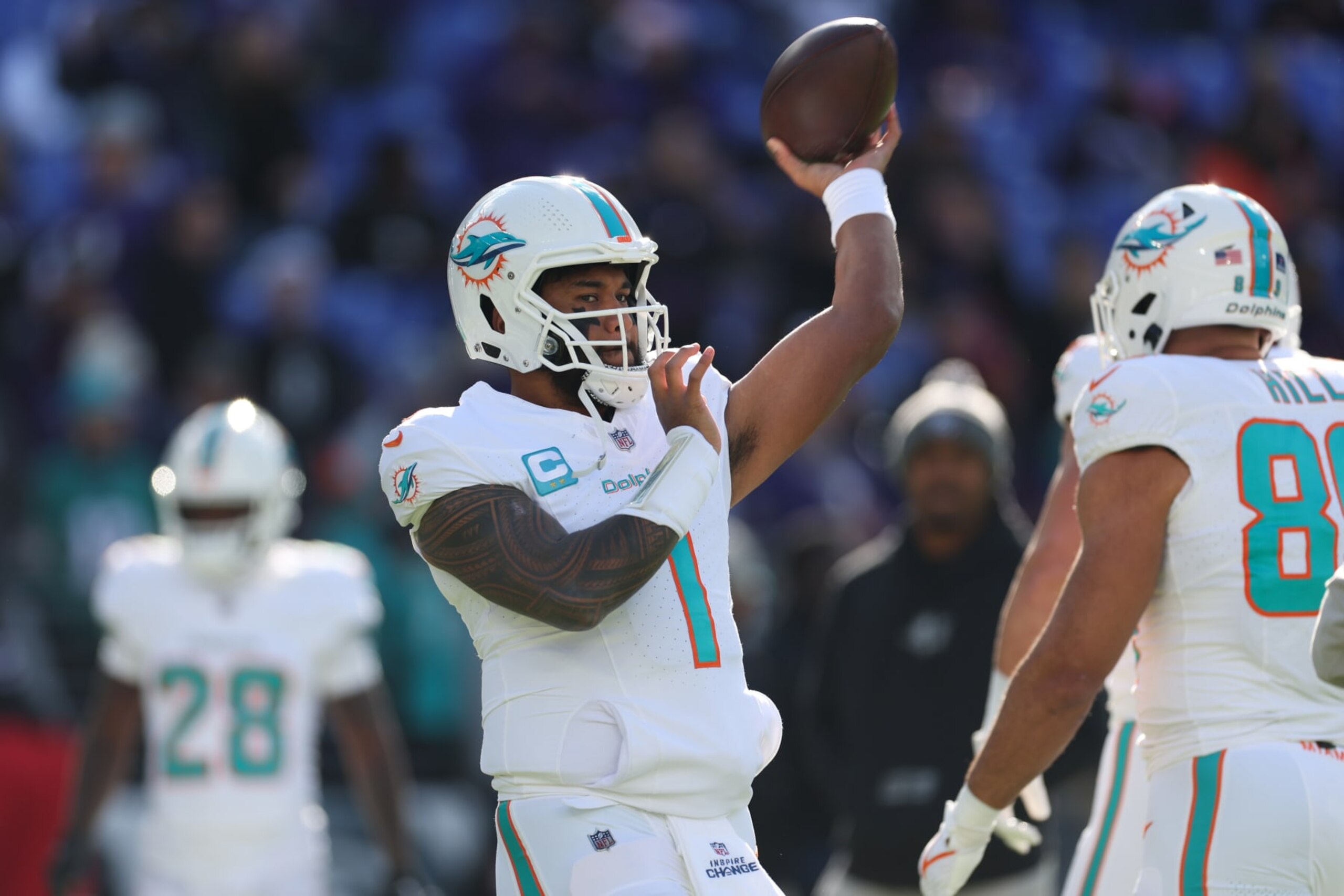 BALTIMORE, MARYLAND - DECEMBER 31: Tua Tagovailoa #1 of the Miami Dolphins warms up prior to a game against the Baltimore Ravens at M&T Bank Stadium on December 31, 2023 in Baltimore, Maryland. (Photo by Rob Carr/Getty Images) BALTIMORE, MARYLAND - DECEMBER 31: Tua Tagovailoa #1 of the Miami Dolphins warms up prior to a game against the Baltimore Ravens at M&T Bank Stadium on December 31, 2023 in Baltimore, Maryland. (Photo by Rob Carr/Getty Images)
