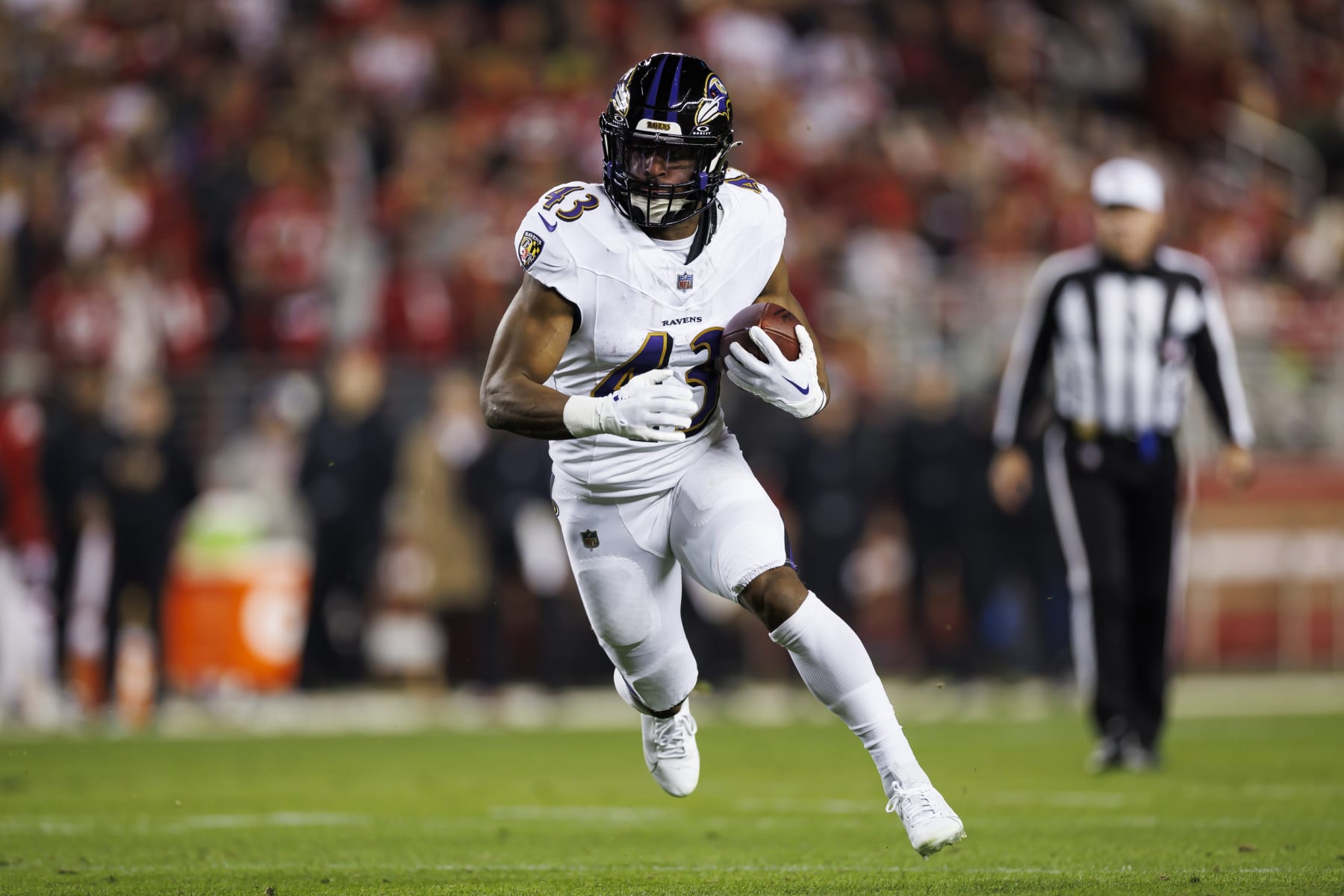 SANTA CLARA, CALIFORNIA - DECEMBER 25: Justice Hill #43 of the Baltimore Ravens carries the ball on a run play during an NFL football game against the San Francisco 49ers at Levi's Stadium on December 25, 2023 in Santa Clara, California. (Photo by Ryan Kang/Getty Images)