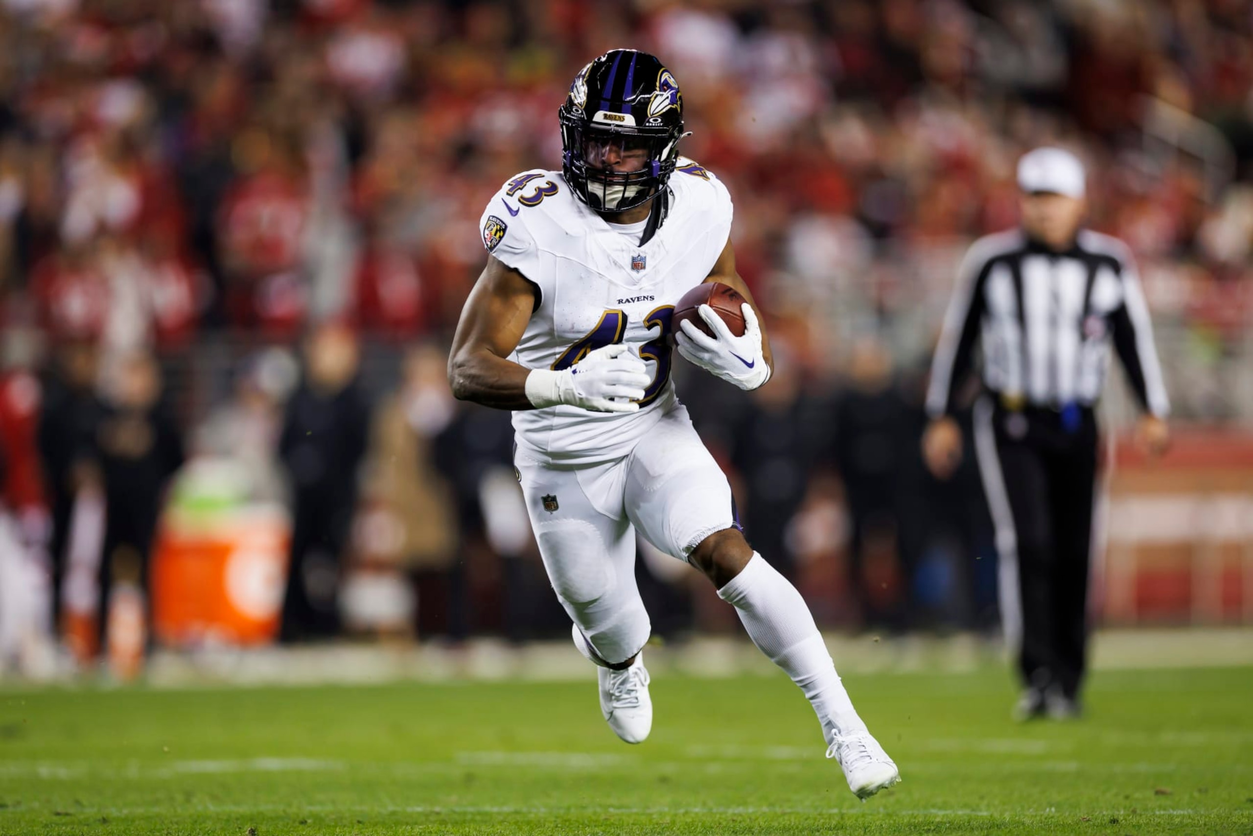 SANTA CLARA, CALIFORNIA - DECEMBER 25: Justice Hill #43 of the Baltimore Ravens carries the ball on a run play during an NFL football game against the San Francisco 49ers at Levi's Stadium on December 25, 2023 in Santa Clara, California. (Photo by Ryan Kang/Getty Images)
