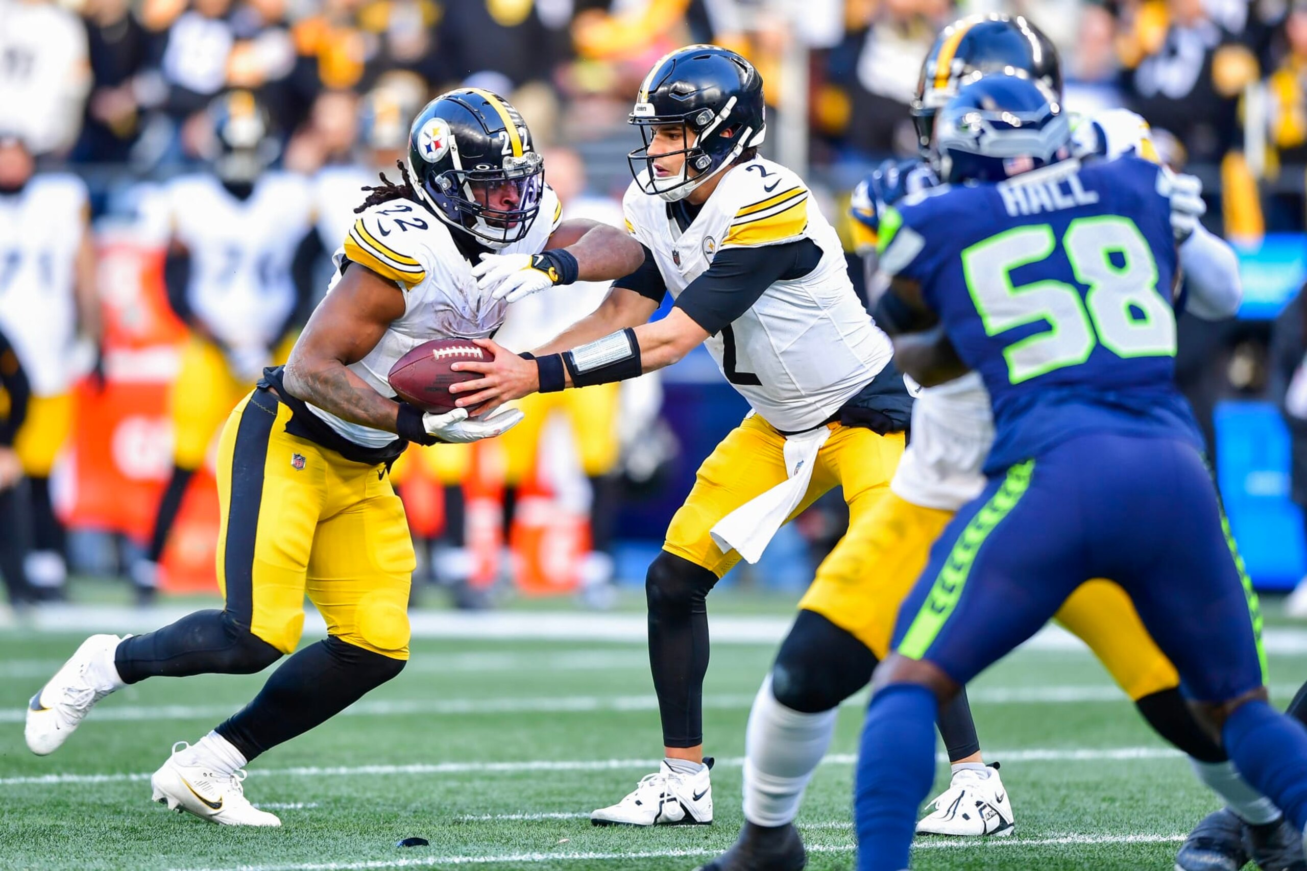 SEATTLE, WASHINGTON - DECEMBER 31: Mason Rudolph #2  hands the ball off to Najee Harris #22 of the Pittsburgh Steelers during the second quarter against the Seattle Seahawks at Lumen Field on December 31, 2023 in Seattle, Washington. (Photo by Jane Gershovich/Getty Images)