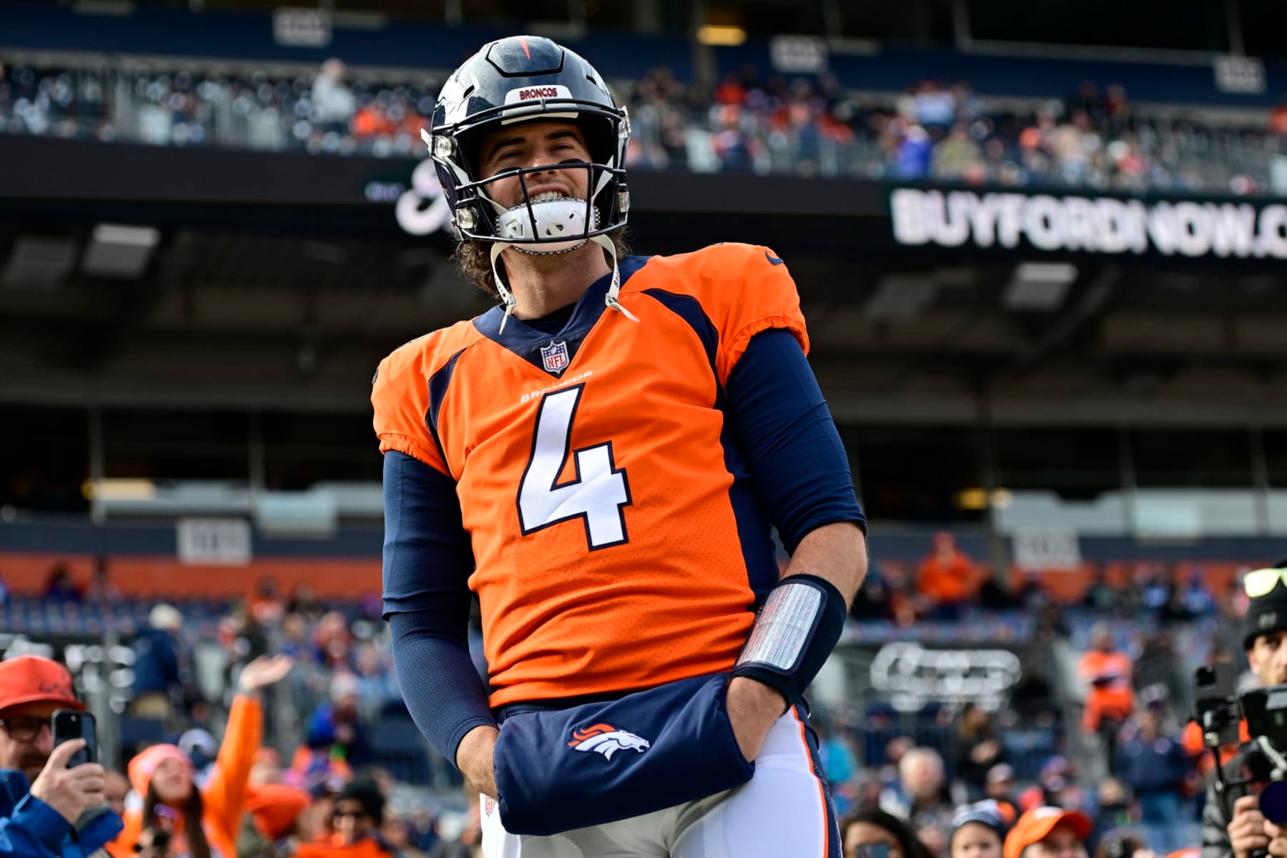 DENVER, COLORADO - DECEMBER 31: Jarrett Stidham #4 of the Denver Broncos warms up prior to a game against the Los Angeles Chargers at Empower Field At Mile High on December 31, 2023 in Denver, Colorado. (Photo by Dustin Bradford/Getty Images)