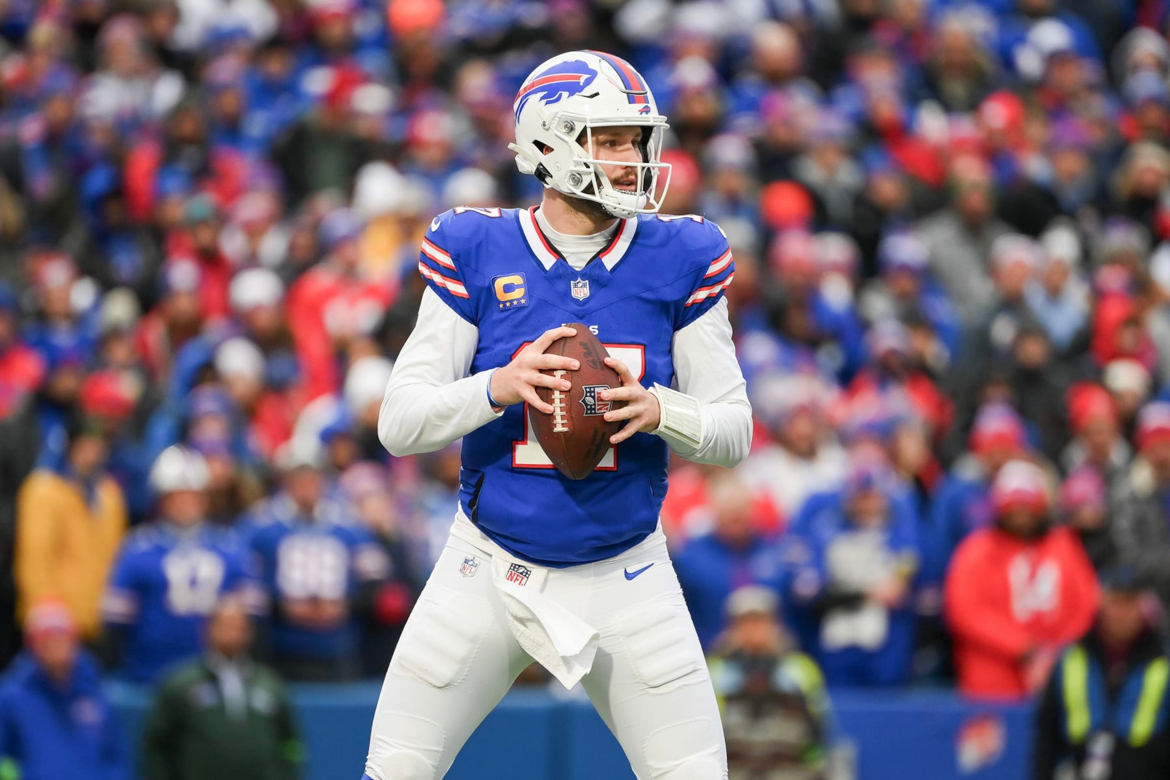 ORCHARD PARK, NEW YORK - DECEMBER 31: Josh Allen #17 of the Buffalo Bills looks to pass against the New England Patriots during the second half of the game at Highmark Stadium on December 31, 2023 in Orchard Park, New York. (Photo by Rich Barnes/Getty Images)