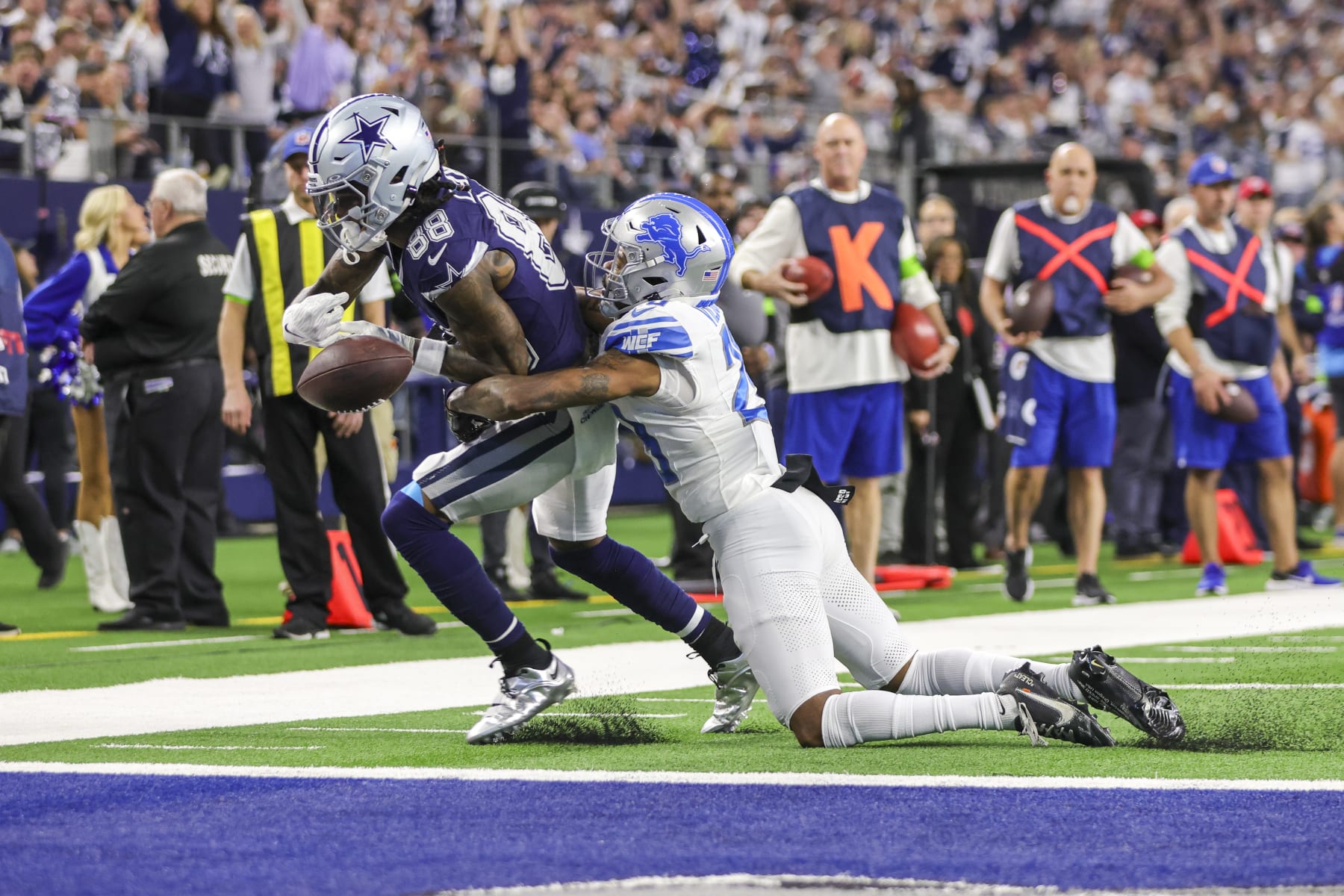 Lions CB Kindle Vildor tries to tackle Cowboys WR CeeDee Lamb