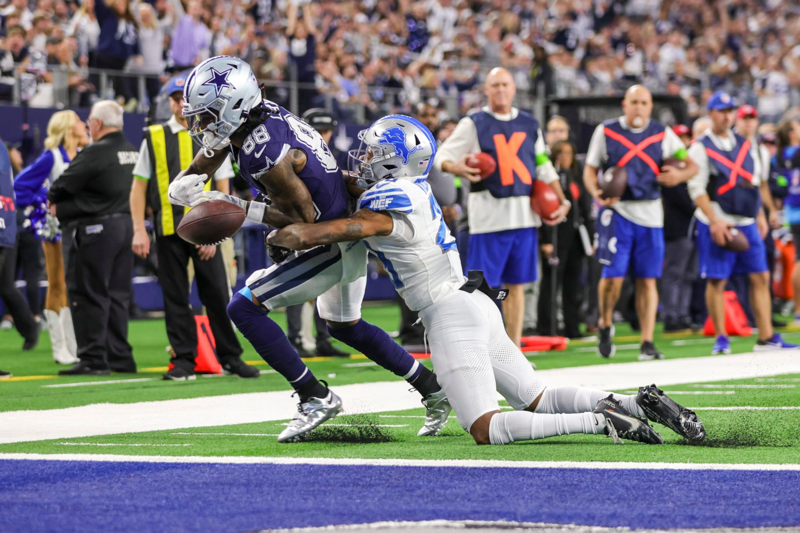 Lions CB Kindle Vildor tries to tackle Cowboys WR CeeDee Lamb