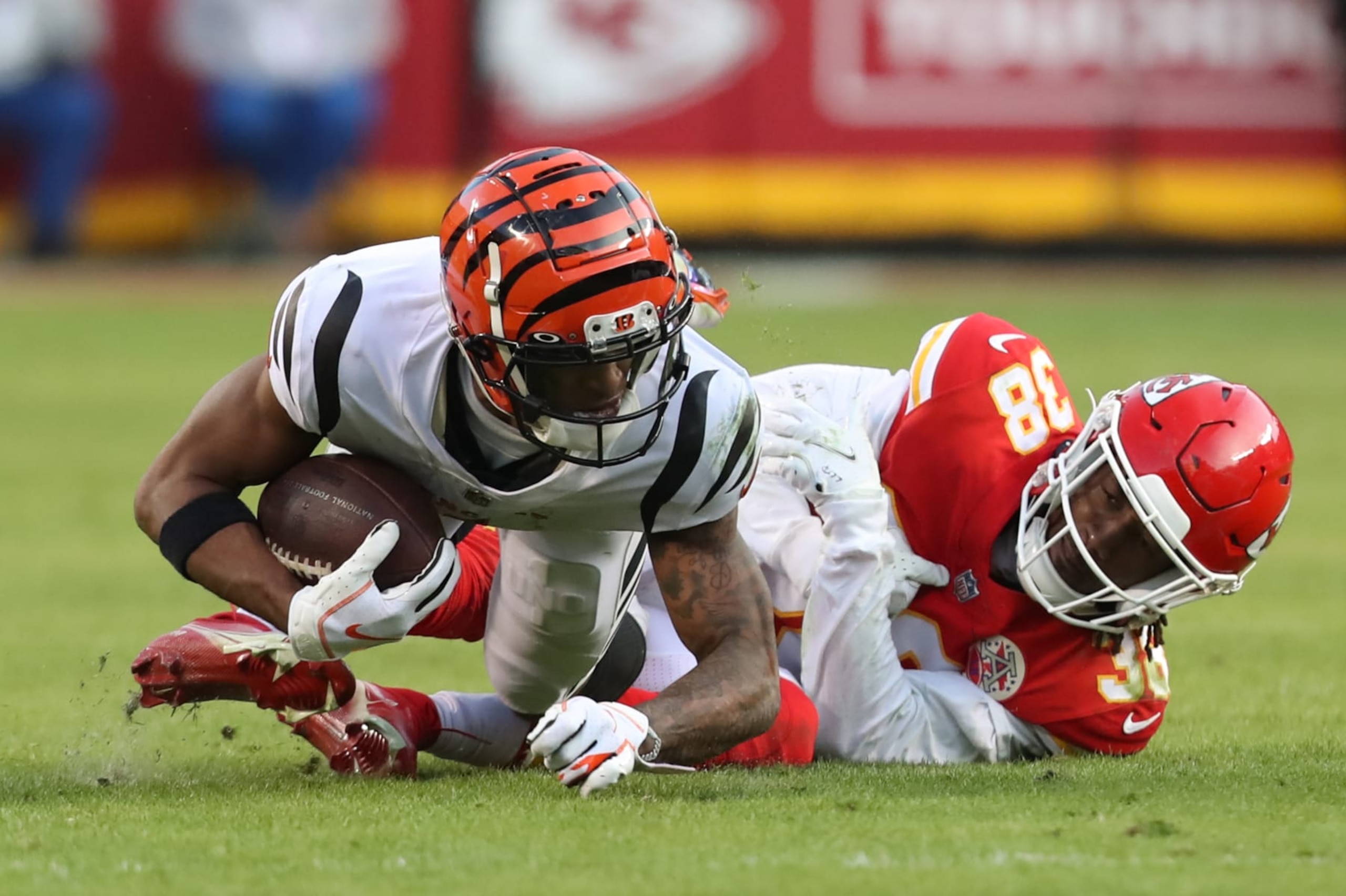 KANSAS CITY, MO - JANUARY 30: Kansas City Chiefs cornerback L'Jarius Sneed (38) tackles Cincinnati Bengals wide receiver Ja'Marr Chase (1) after a catch in the fourth quarter of the AFC Championship game between the Cincinnati Bengals and Kansas City Chiefs on Jan 30, 2022 at GEHA Field at Arrowhead Stadium in Kansas City, MO. (Photo by Scott Winters/Icon Sportswire via Getty Images)