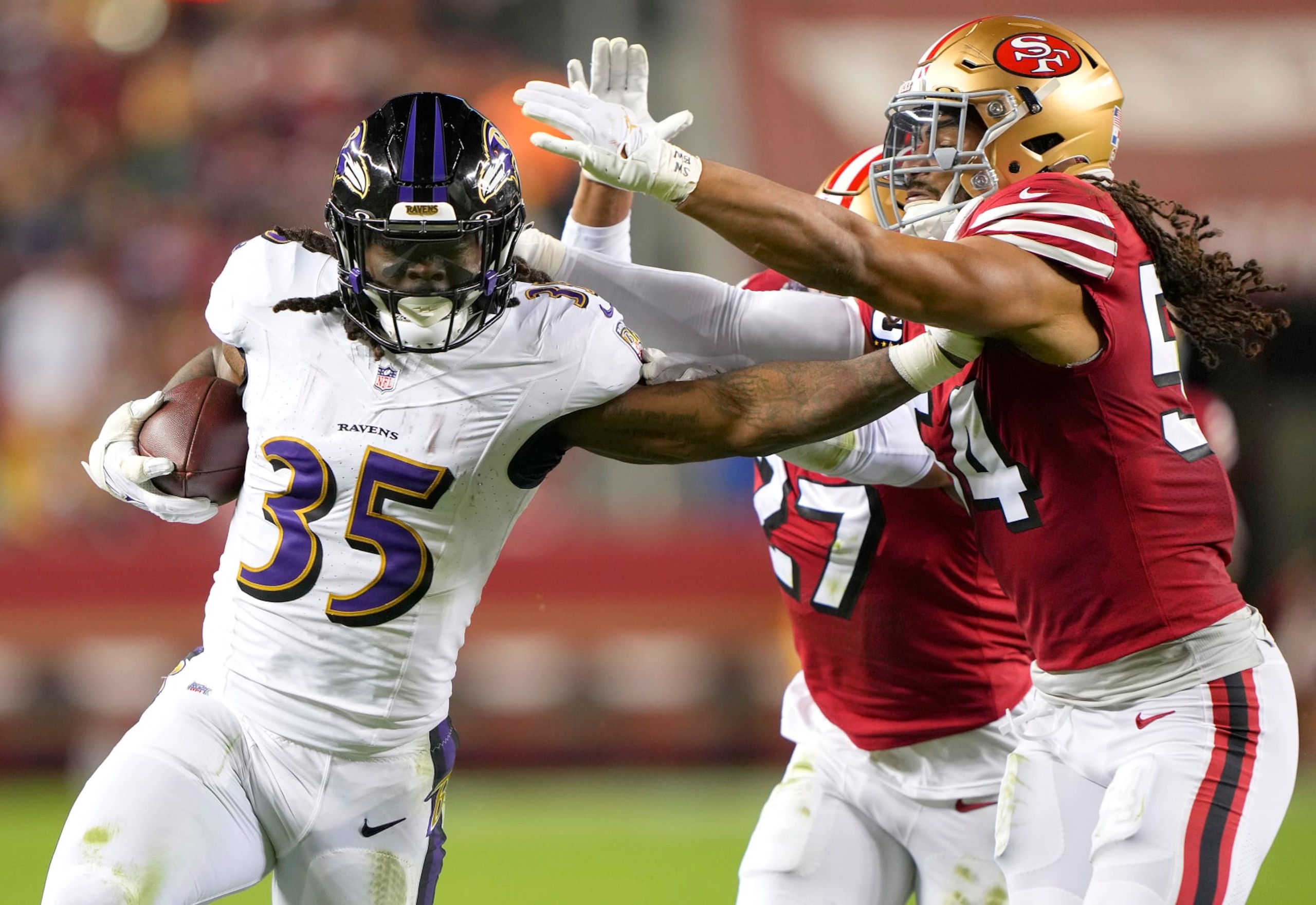 Ravens RB Gus Edwards runs against the 49ers