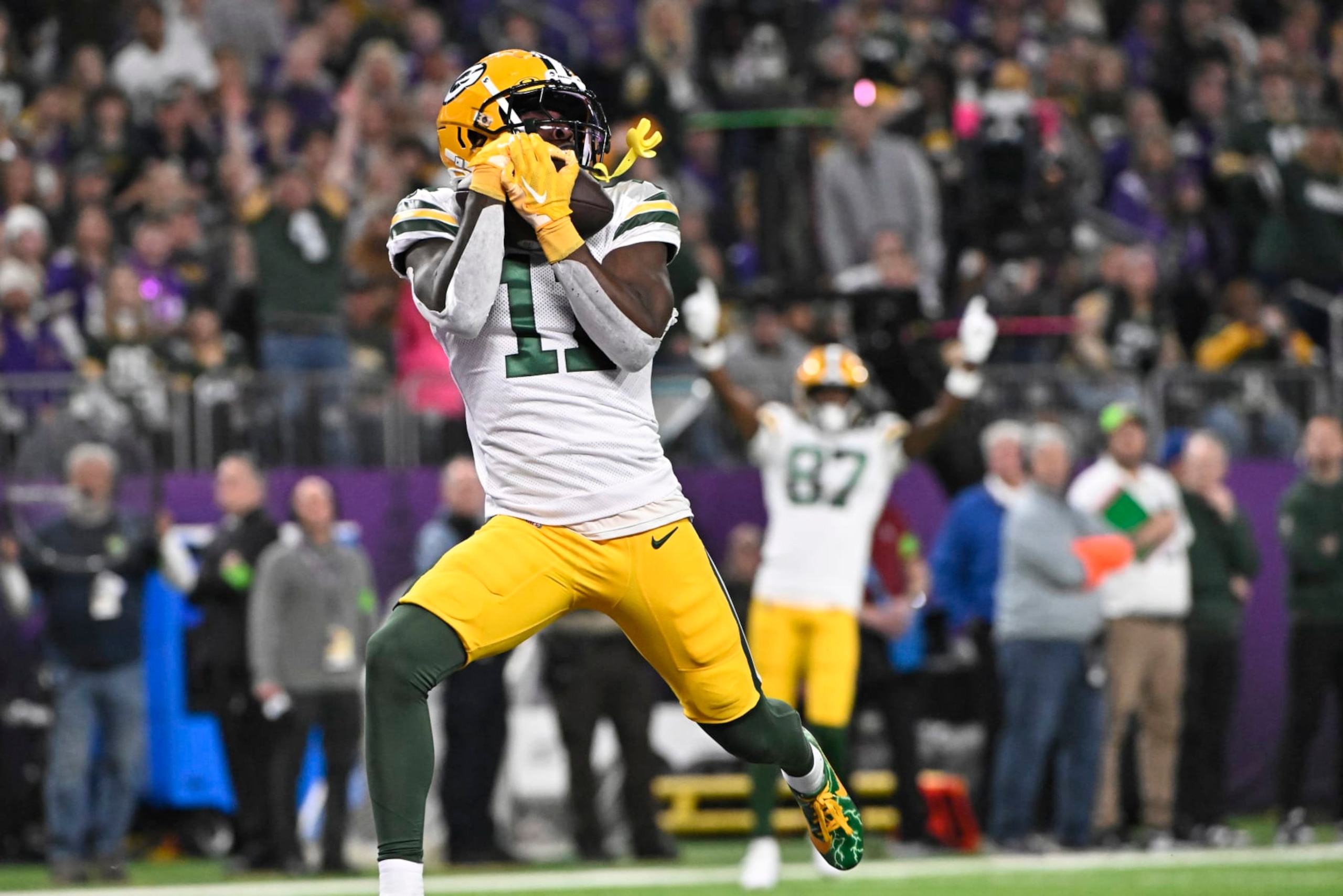 MINNEAPOLIS, MINNESOTA - DECEMBER 31: Jayden Reed #11 of the Green Bay Packers catches a touchdown pass during the first quarter against the Minnesota Vikings at U.S. Bank Stadium on December 31, 2023 in Minneapolis, Minnesota. (Photo by Stephen Maturen/Getty Images)