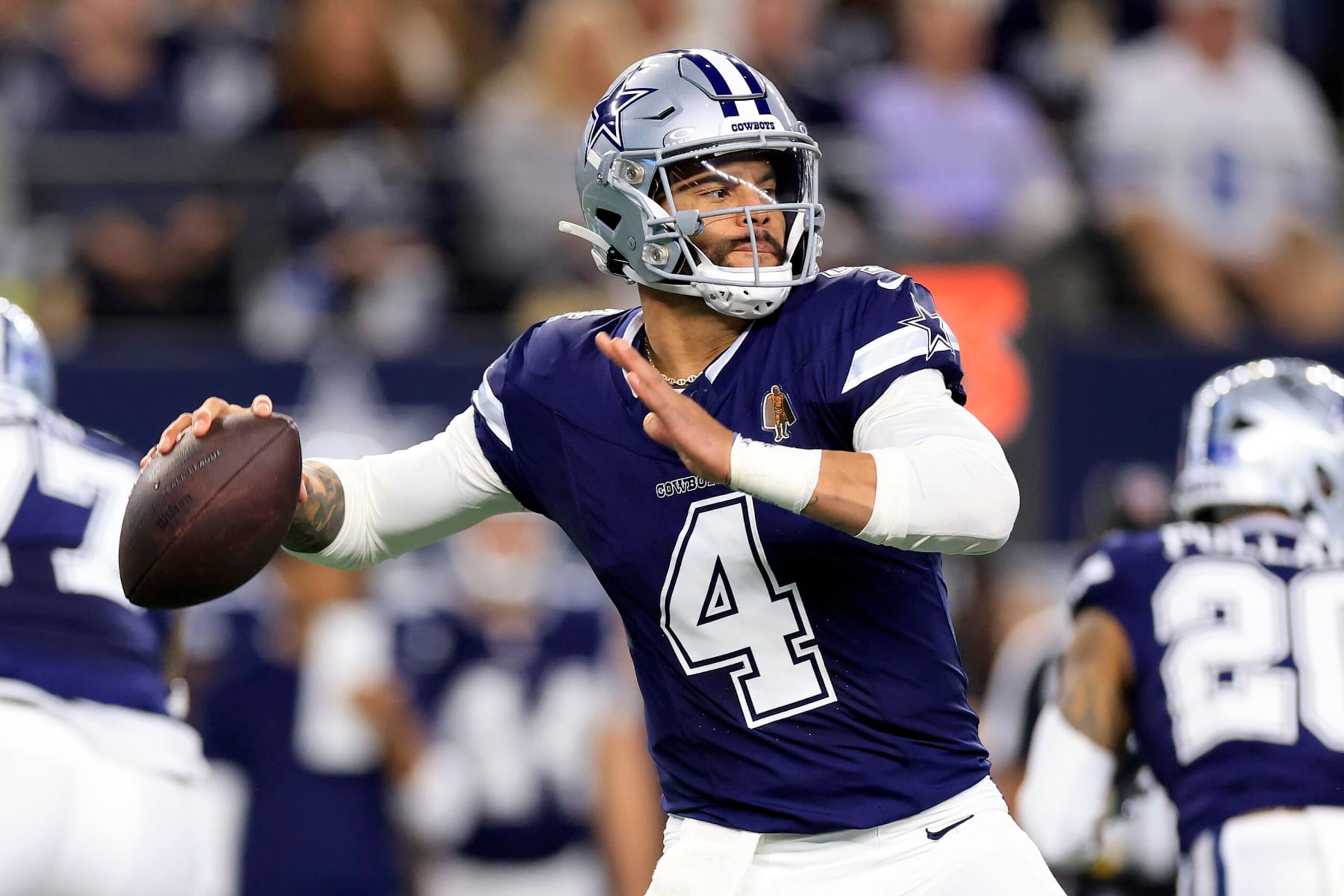 ARLINGTON, TEXAS - DECEMBER 30: Dak Prescott #4 of the Dallas Cowboys throws a pass against the Detroit Lions during the first quarter in the game at AT&T Stadium on December 30, 2023 in Arlington, Texas. (Photo by Ron Jenkins/Getty Images)