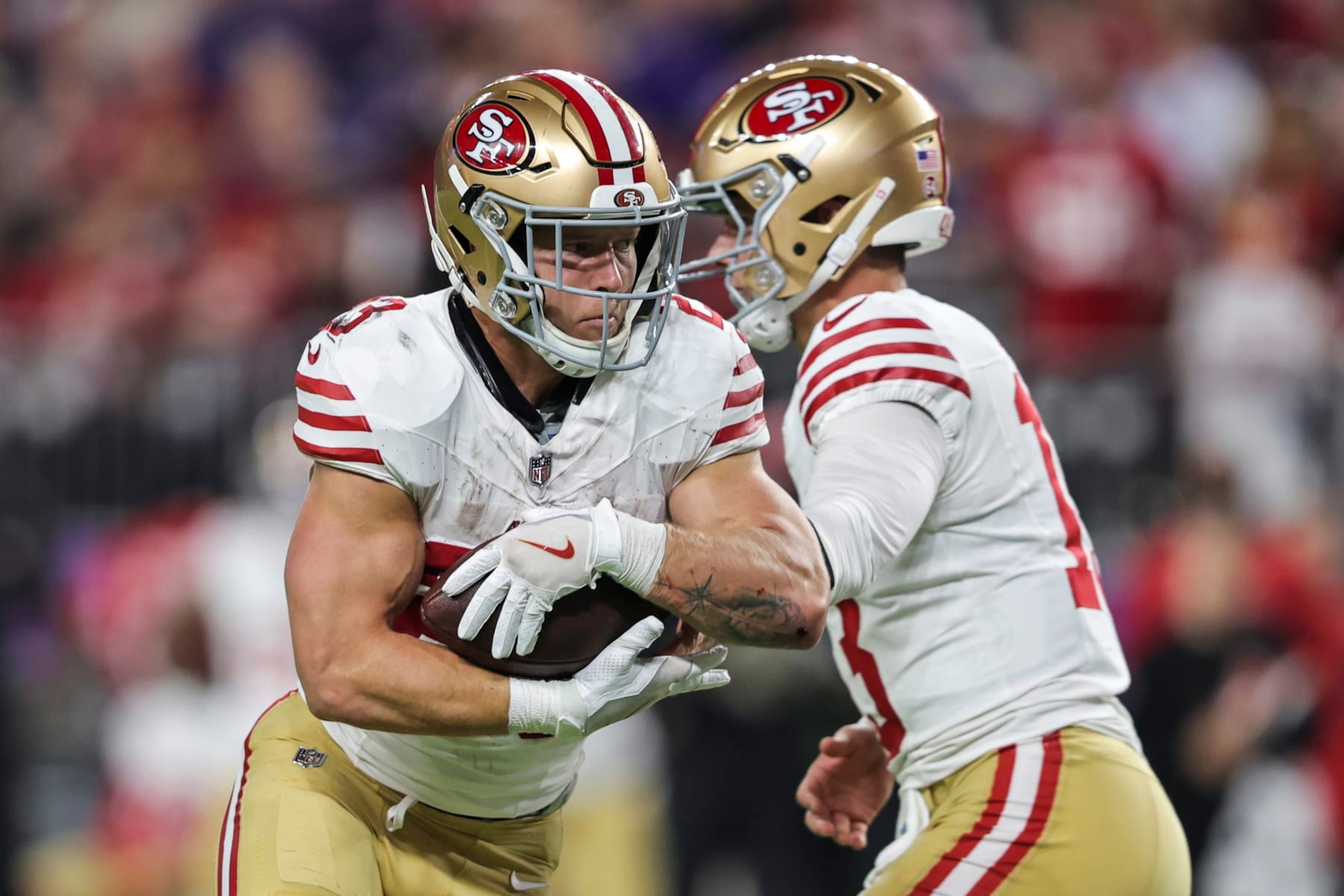 MINNEAPOLIS, MINNESOTA - OCTOBER 23: Brock Purdy #13 of the San Francisco 49ers hands the ball off to Christian McCaffrey #23 of the San Francisco 49ers during an NFL football game between the Minnesota Vikings and the San Francisco 49ers at U.S. Bank Stadium on October 23, 2023 in Minneapolis, Minnesota. (Photo by Michael Owens/Getty Images)