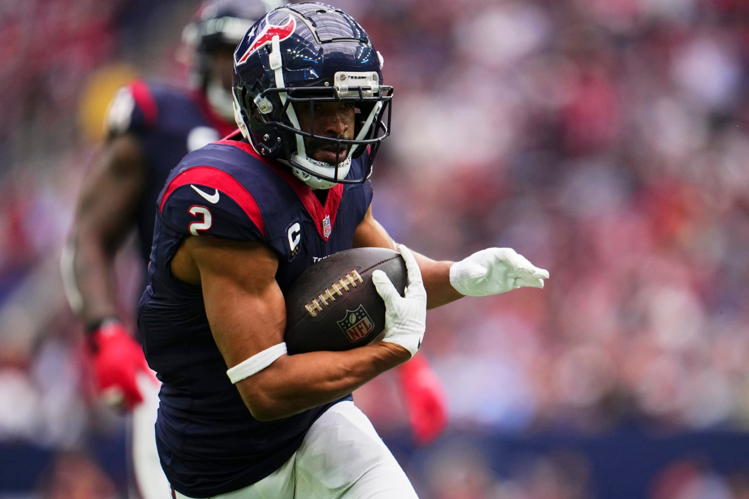 HOUSTON, TX - DECEMBER 31: Robert Woods #2 of the Houston Texans runs with the ball against the Tennessee Titans during the first half at NRG Stadium on December 31, 2023 in Houston, Texas. (Photo by Cooper Neill/Getty Images)