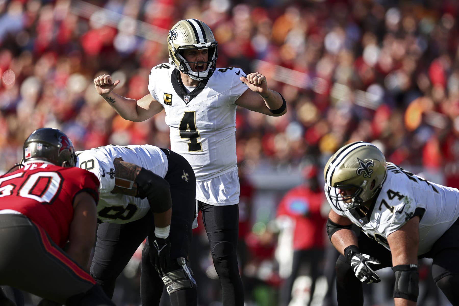 TAMPA, FL - DECEMBER 31: Derek Carr #4 of the New Orleans Saints calls a play at the line of scrimmage during the third quarter of an NFL football game against the Tampa Bay Buccaneers at Raymond James Stadium on December 31, 2023 in Tampa, Florida. (Photo by Kevin Sabitus/Getty Images)