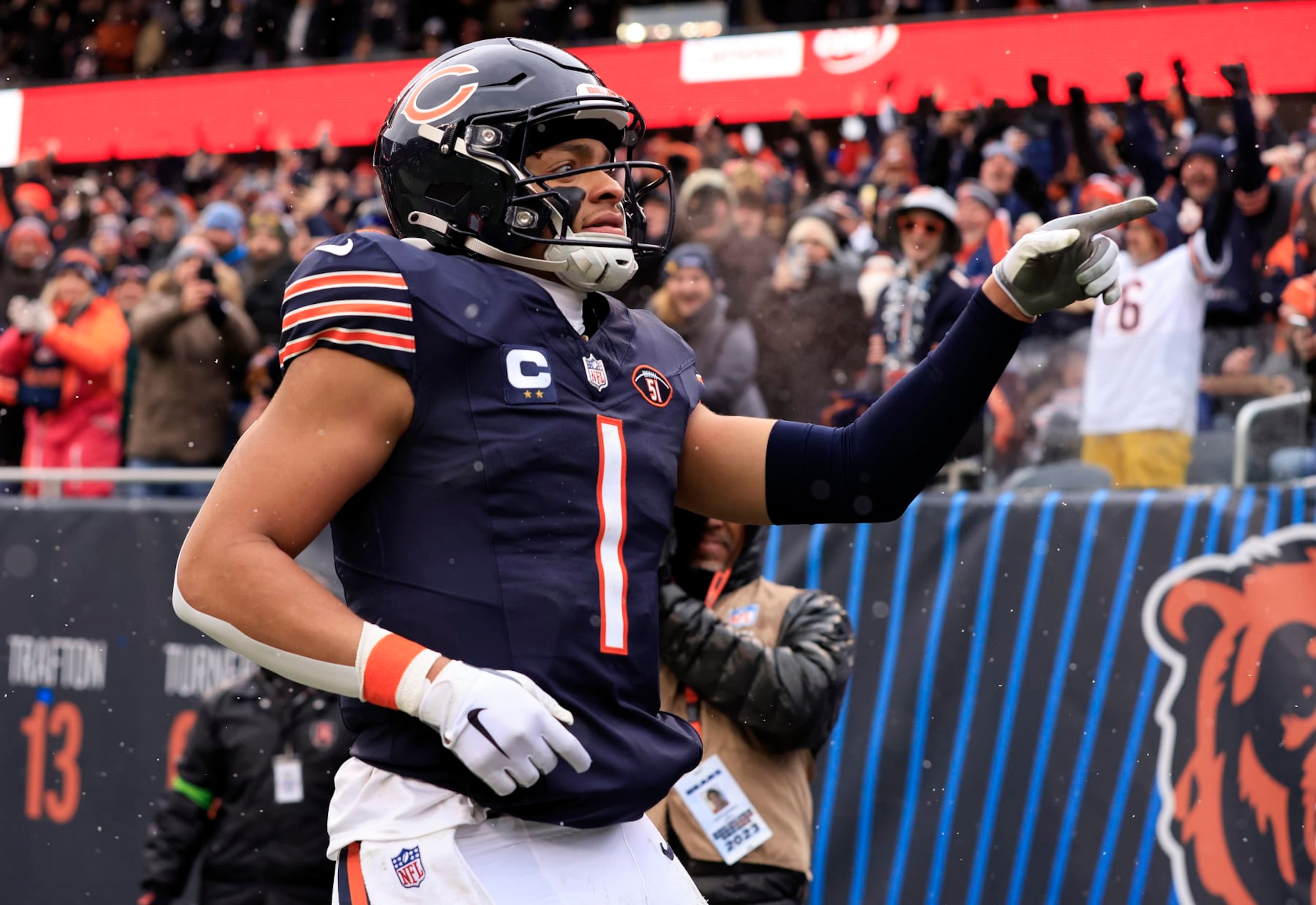 CHICAGO, ILLINOIS - DECEMBER 31: Justin Fields #1 of the Chicago Bears celebrates after his rushing touchdown during the second quarter against the Atlanta Falcons at Soldier Field on December 31, 2023 in Chicago, Illinois. (Photo by Justin Casterline/Getty Images)