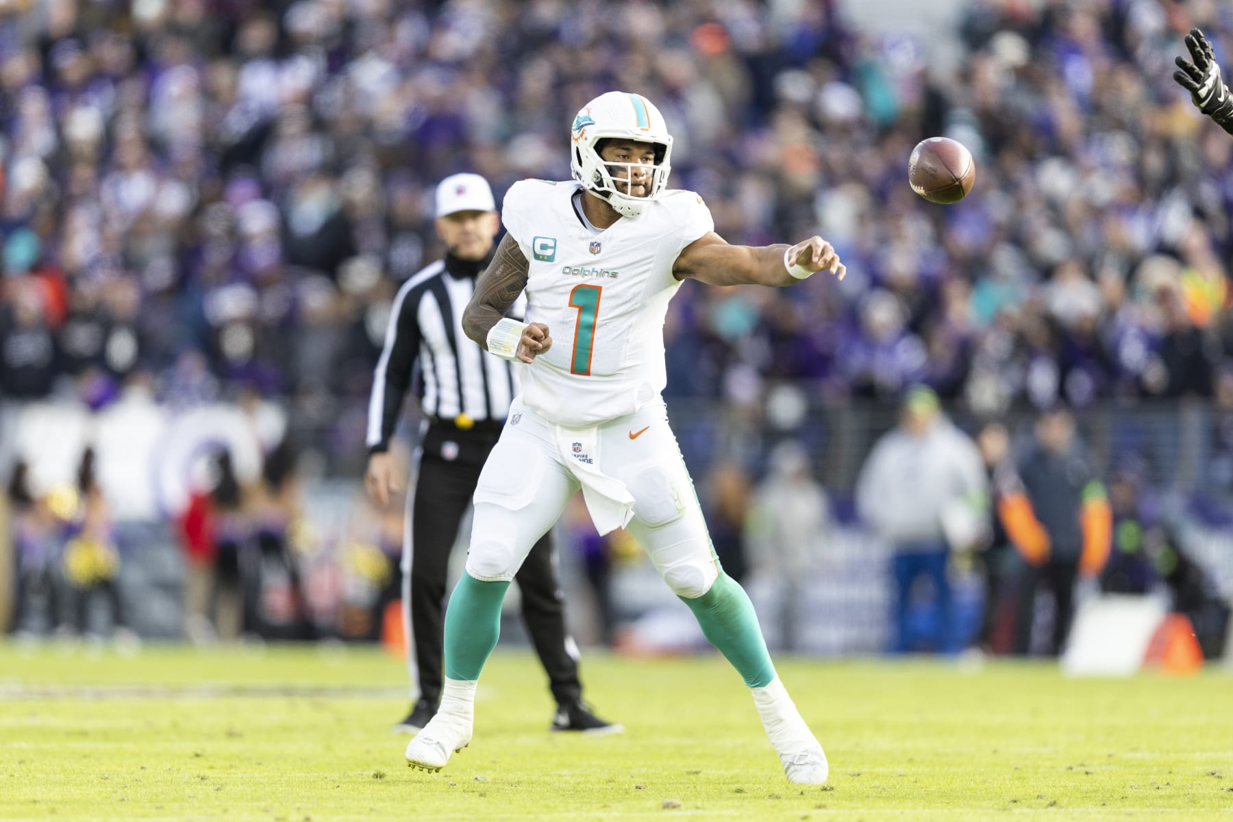 BALTIMORE, MARYLAND - DECEMBER 31: Tua Tagovailoa #1 of the Miami Dolphins throws a pass during an NFL football game between the Baltimore Ravens and the Miami Dolphins at M&T Bank Stadium on December 31, 2023 in Baltimore, Maryland. (Photo by Michael Owens/Getty Images)