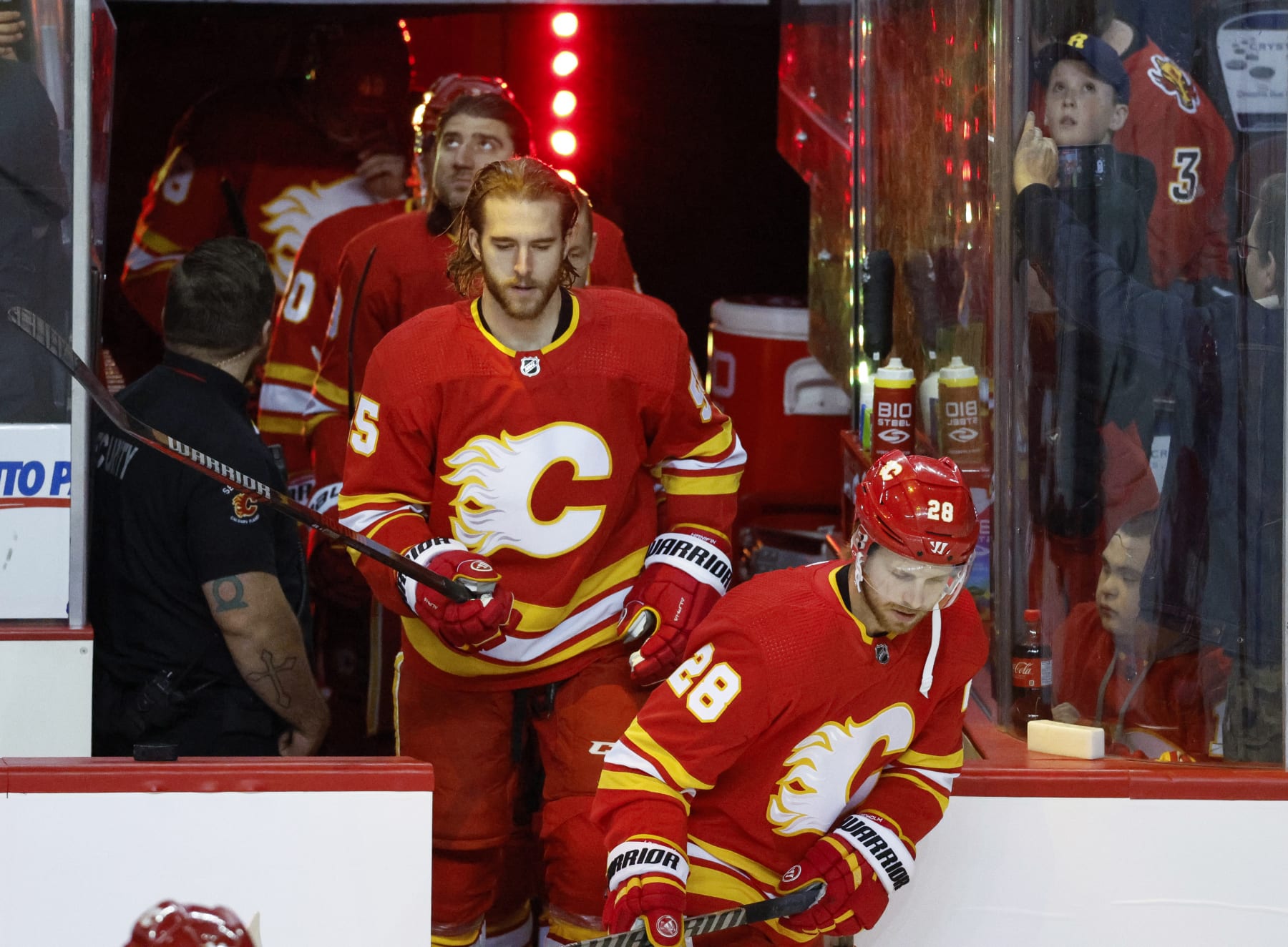 Calgary Flames defenseman Noah Hanifin (No. 55) and center Elias Lindholm (No. 28). 