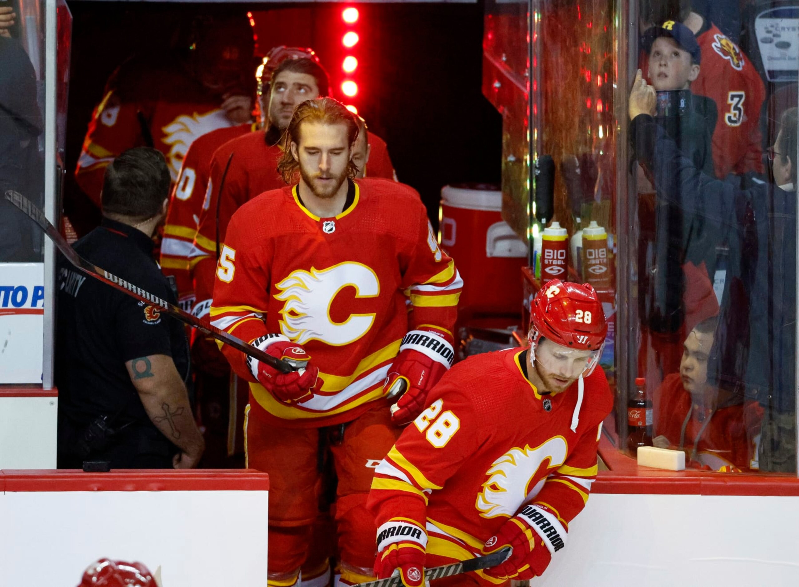Calgary Flames defenseman Noah Hanifin (No. 55) and center Elias Lindholm (No. 28). 
