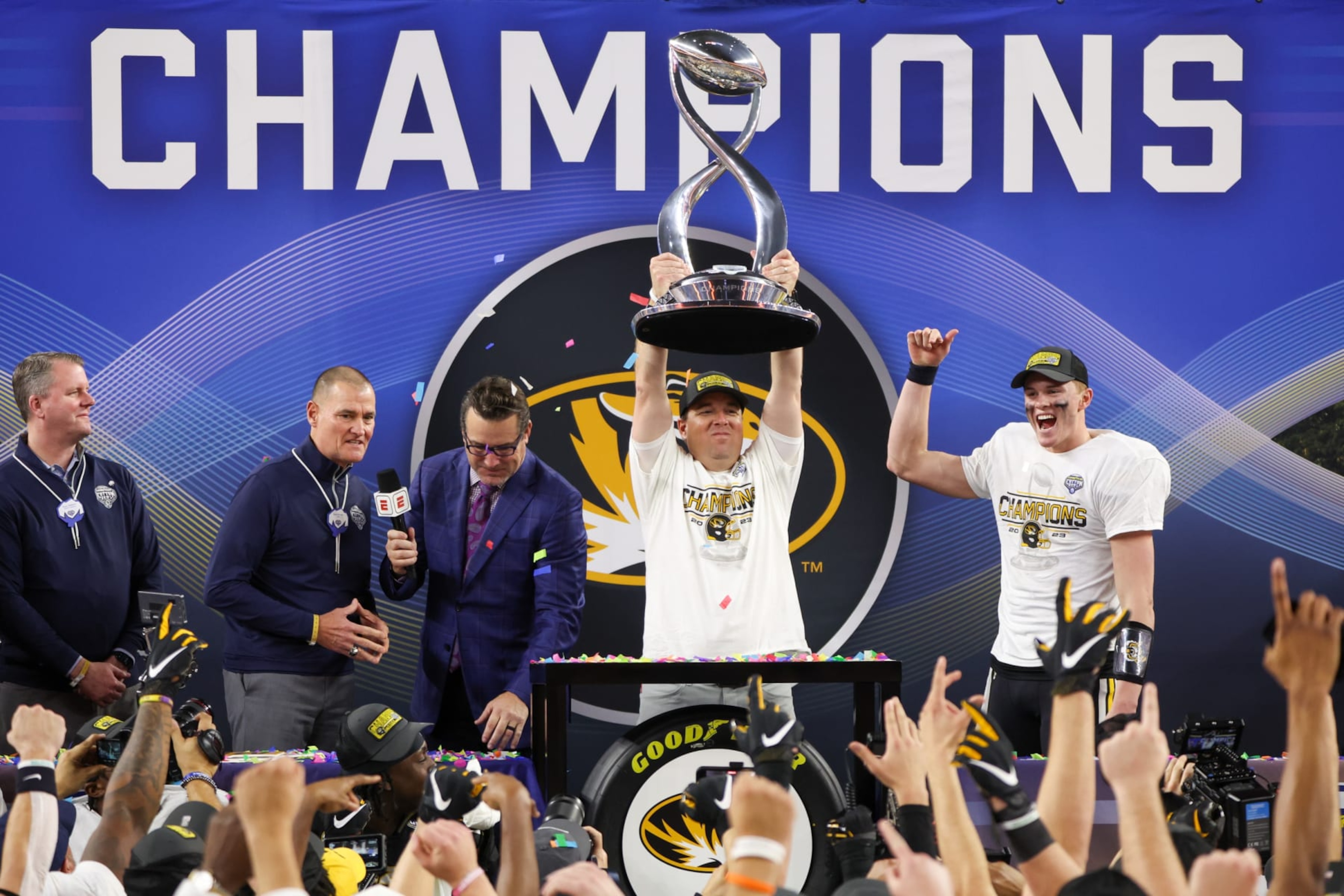 ARLINGTON, TX - DECEMBER 29: Missouri Tigers head coach Eliah Drinkwitz raises the trophy after winning the 88th Goodyear Cotton Bowl Classic between the Missouri Tigers and Ohio State Buckeyes on December 29, 2023 at AT&T Stadium in Arlington, TX. (Photo by George Walker/Icon Sportswire via Getty Images)