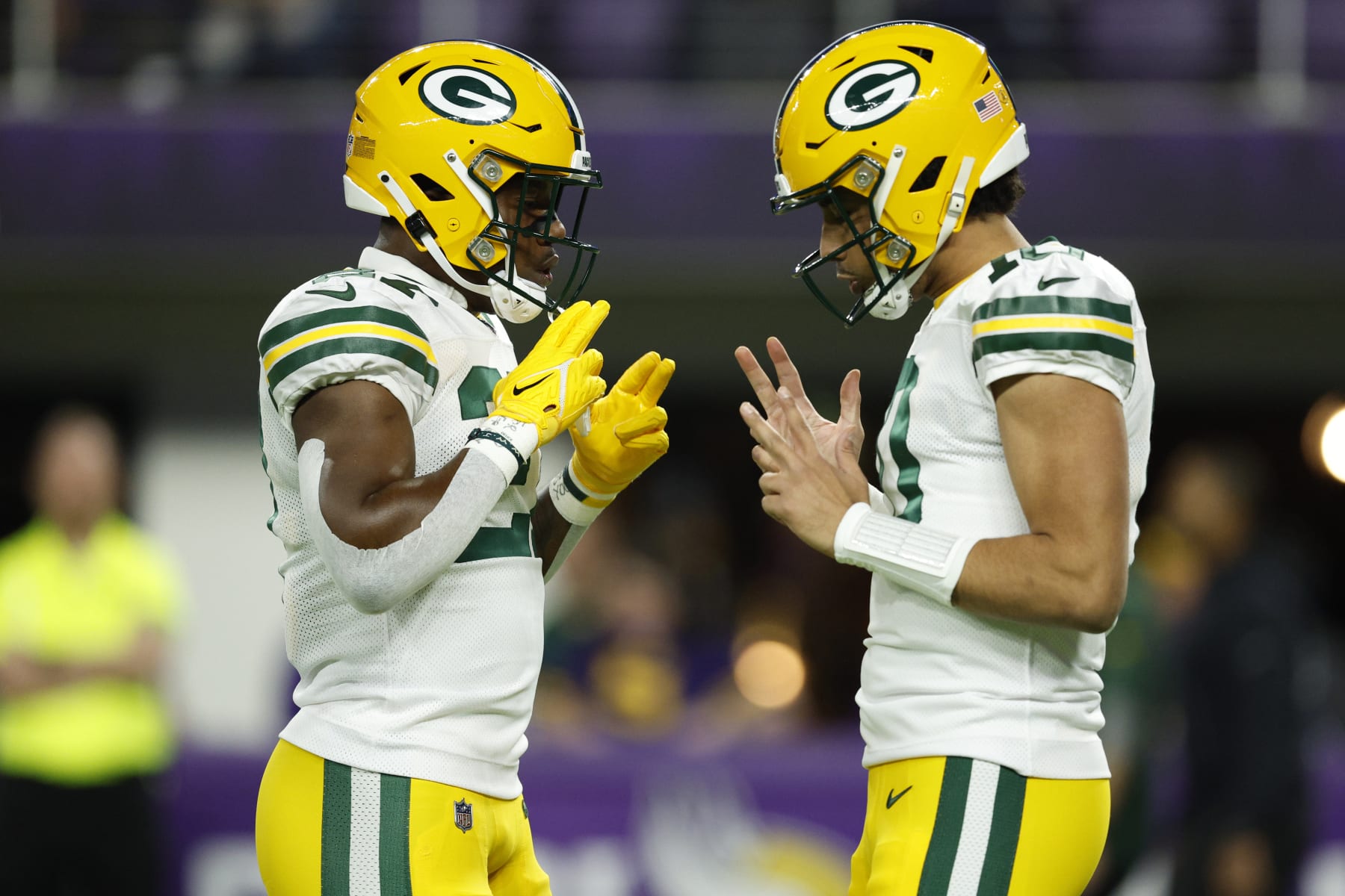 MINNEAPOLIS, MINNESOTA - DECEMBER 31: Patrick Taylor #27 and Jordan Love #10 of the Green Bay Packers warm up prior to a game against the Minnesota Vikings at U.S. Bank Stadium on December 31, 2023 in Minneapolis, Minnesota. (Photo by David Berding/Getty Images)