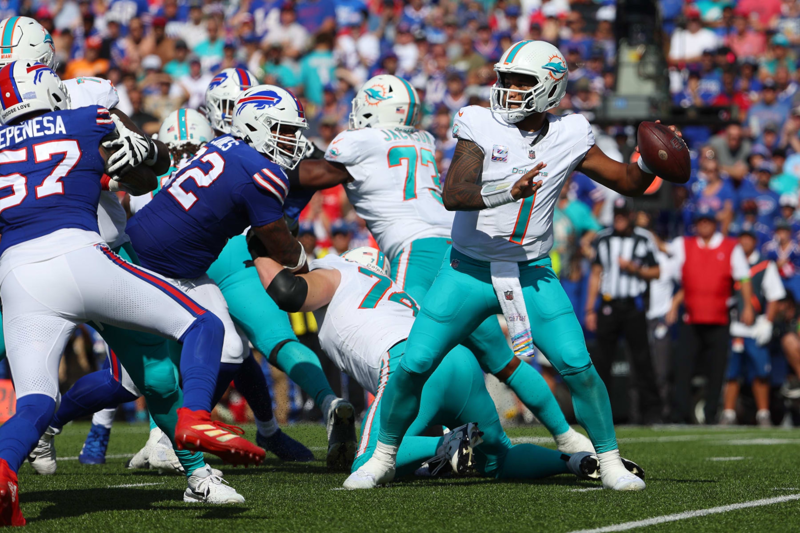 ORCHARD PARK, NEW YORK - OCTOBER 01: Tua Tagovailoa #1 of the Miami Dolphins passes the ball against the Buffalo Bills during the second quarter at Highmark Stadium on October 01, 2023 in Orchard Park, New York. (Photo by Timothy T Ludwig/Getty Images) ORCHARD PARK, NEW YORK - OCTOBER 01: Tua Tagovailoa #1 of the Miami Dolphins passes the ball against the Buffalo Bills during the second quarter at Highmark Stadium on October 01, 2023 in Orchard Park, New York. (Photo by Timothy T Ludwig/Getty Images)
