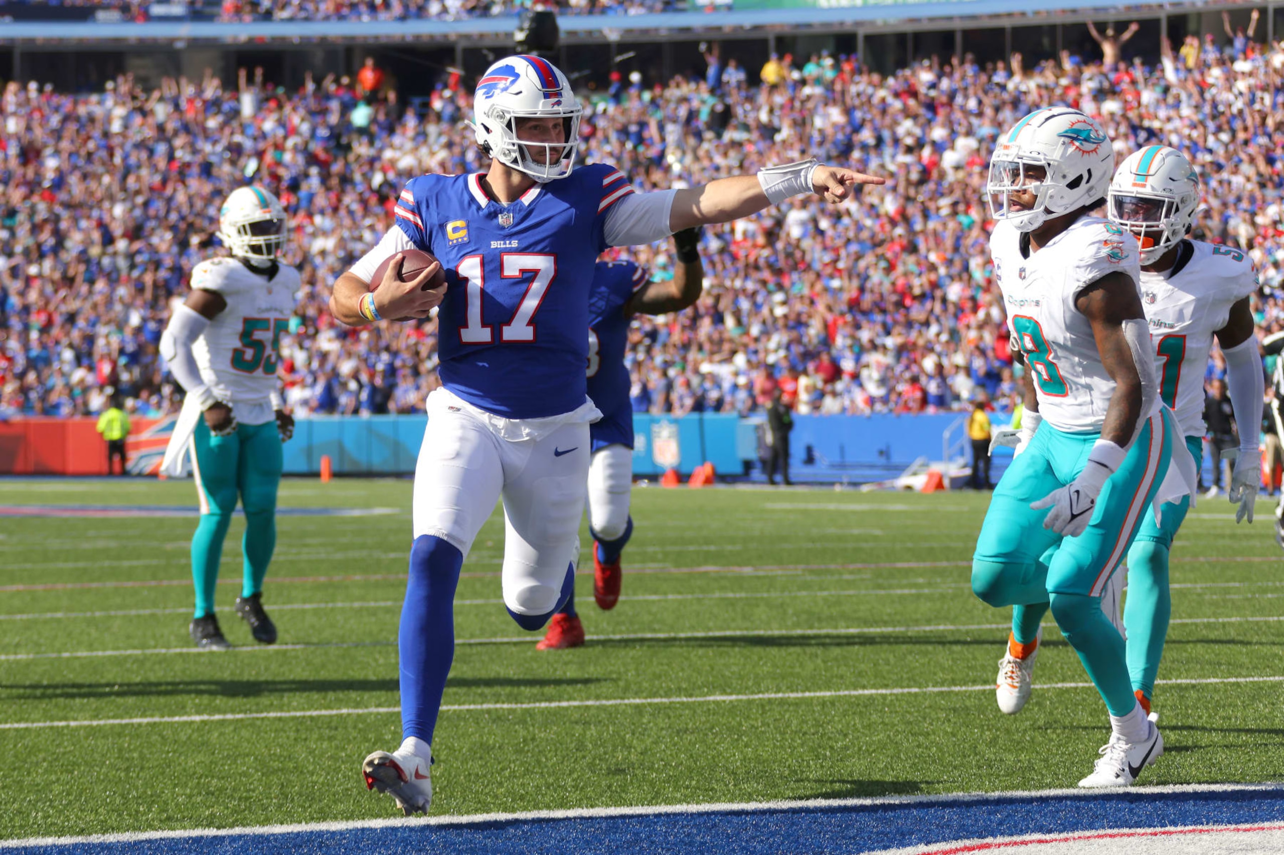 ORCHARD PARK, NEW YORK - OCTOBER 01: Josh Allen #17 of the Buffalo Bills runs the ball for a touchdown against the Miami Dolphins during the fourth quarter at Highmark Stadium on October 01, 2023 in Orchard Park, New York. (Photo by Timothy T Ludwig/Getty Images) ORCHARD PARK, NEW YORK - OCTOBER 01: Josh Allen #17 of the Buffalo Bills runs the ball for a touchdown against the Miami Dolphins during the fourth quarter at Highmark Stadium on October 01, 2023 in Orchard Park, New York. (Photo by Timothy T Ludwig/Getty Images)