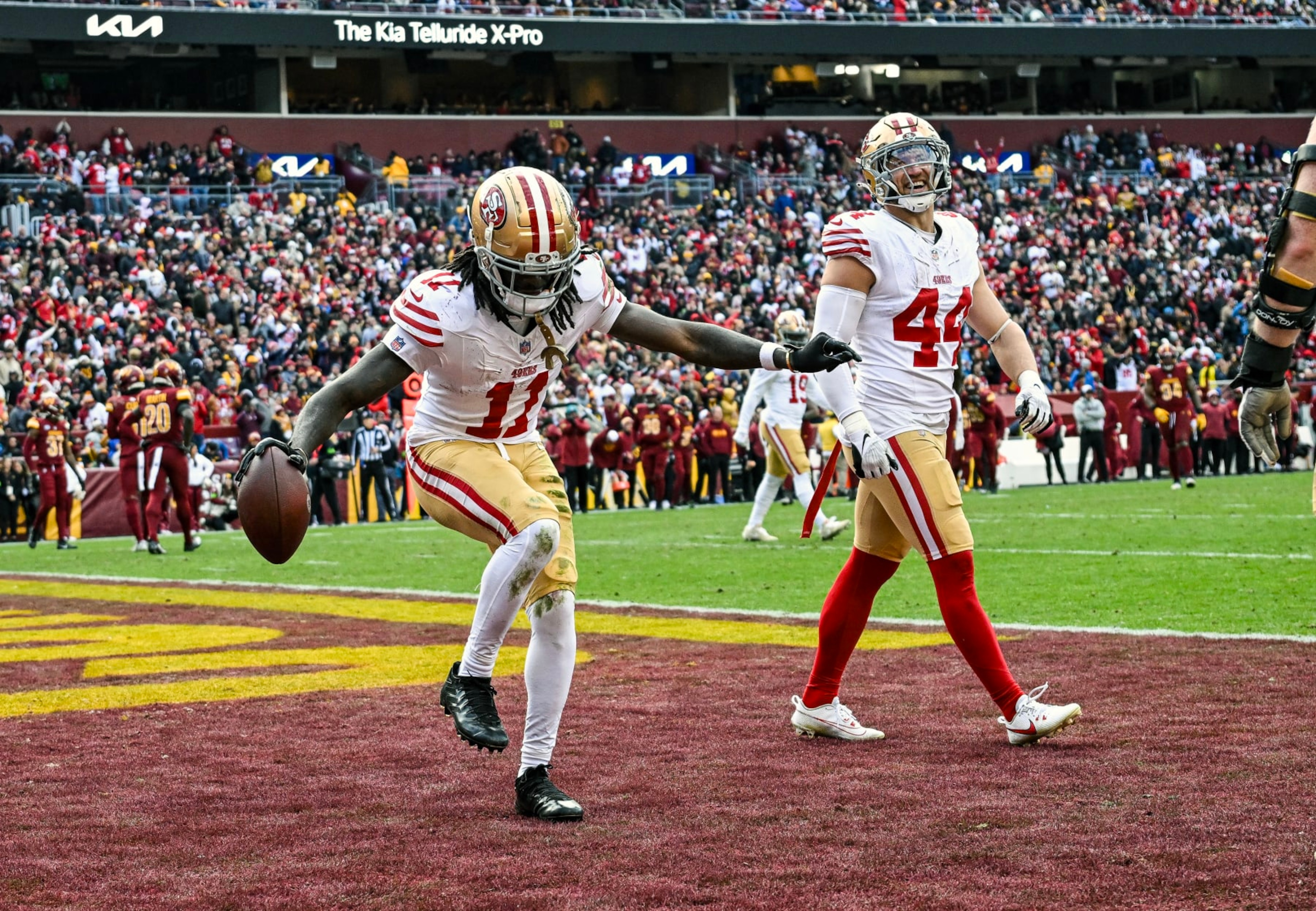 LANDOVER, MD - DECEMBER 31: San Francisco 49ers wide receiver Brandon Aiyuk (11) celebrates his touchdown reception during the NFL game between the San Francisco 49ers and the Washington Commanders on December 31, 2023 at Fed Ex Field in Landover, MD. (Photo by Mark Goldman/Icon Sportswire via Getty Images)