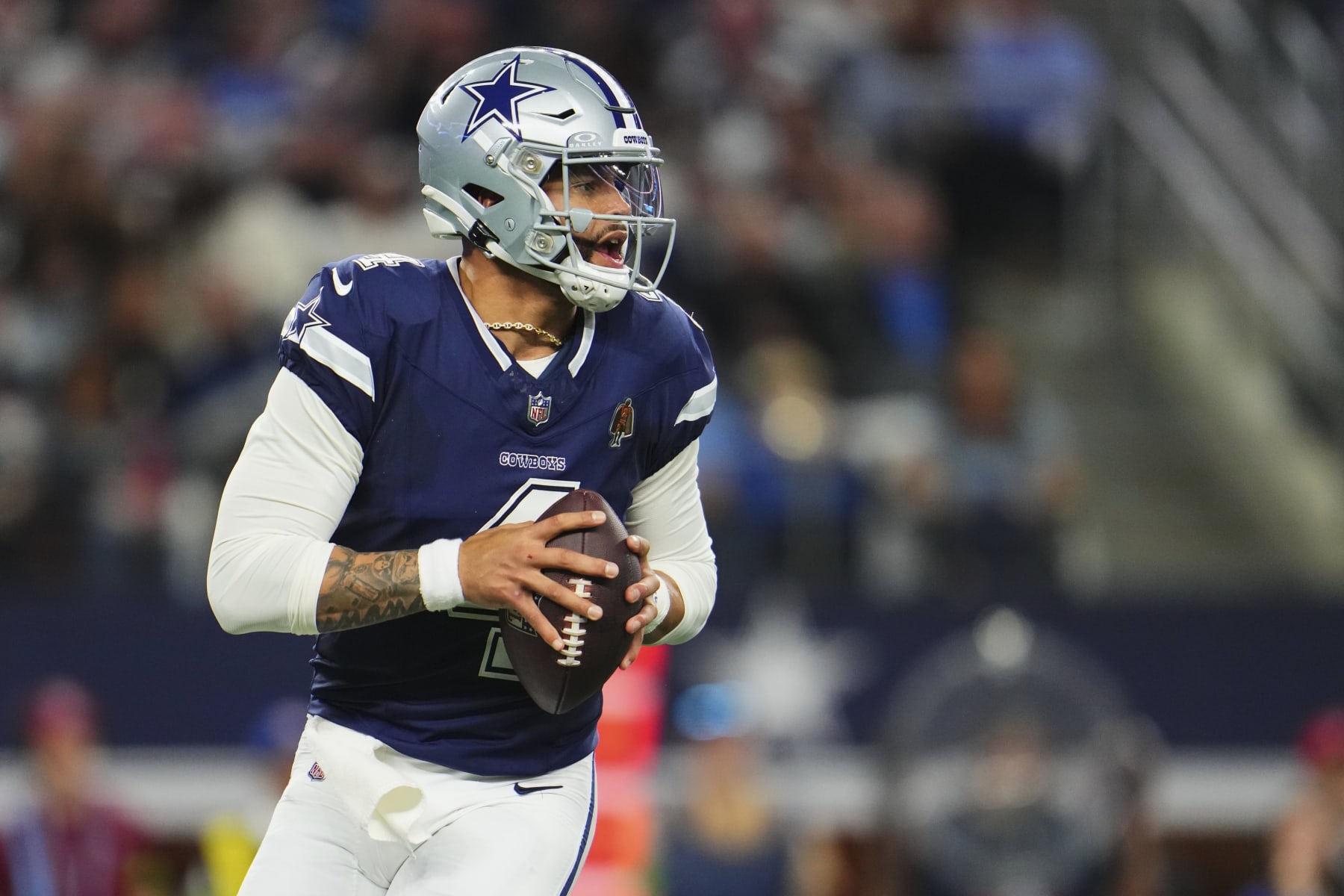 ARLINGTON, TX - DECEMBER 30: Dak Prescott #4 of the Dallas Cowboys drops back to pass against the Detroit Lions during the first half at AT&T Stadium on December 30, 2023 in Arlington, Texas. (Photo by Cooper Neill/Getty Images)