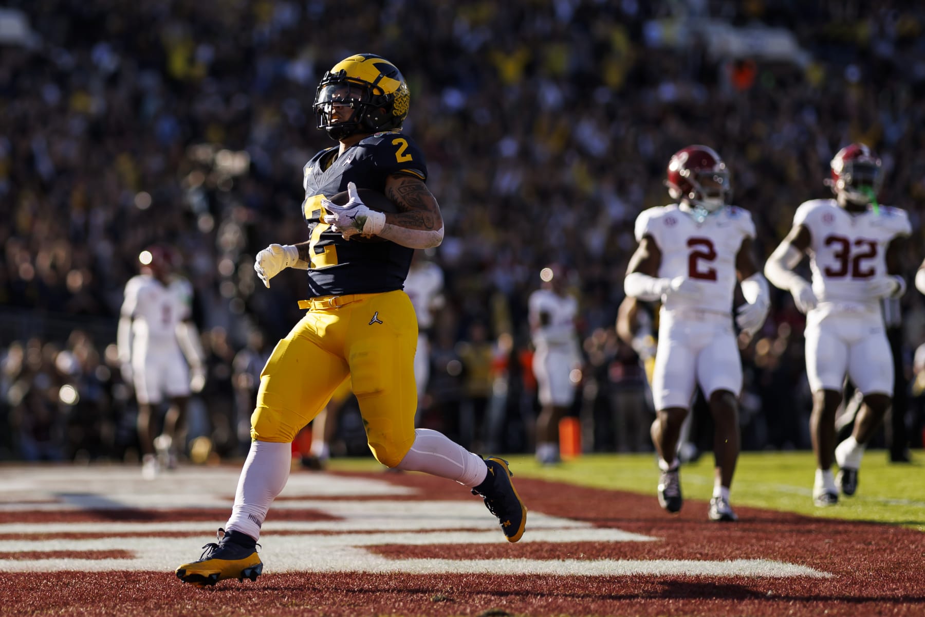 PASADENA, CALIFORNIA - JANUARY 01: Running back Blake Corum #2 of the Michigan Wolverines scores a touchdown during the CFP Semifinal Rose Bowl Game against the Alabama Crimson Tide at Rose Bowl Stadium on January 1, 2024 in Pasadena, California. (Photo by Ryan Kang/Getty Images)