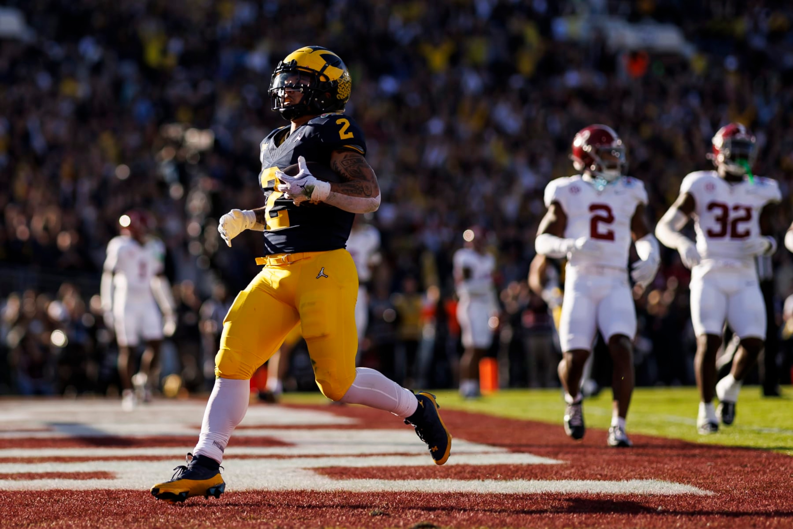 PASADENA, CALIFORNIA - JANUARY 01: Running back Blake Corum #2 of the Michigan Wolverines scores a touchdown during the CFP Semifinal Rose Bowl Game against the Alabama Crimson Tide at Rose Bowl Stadium on January 1, 2024 in Pasadena, California. (Photo by Ryan Kang/Getty Images)