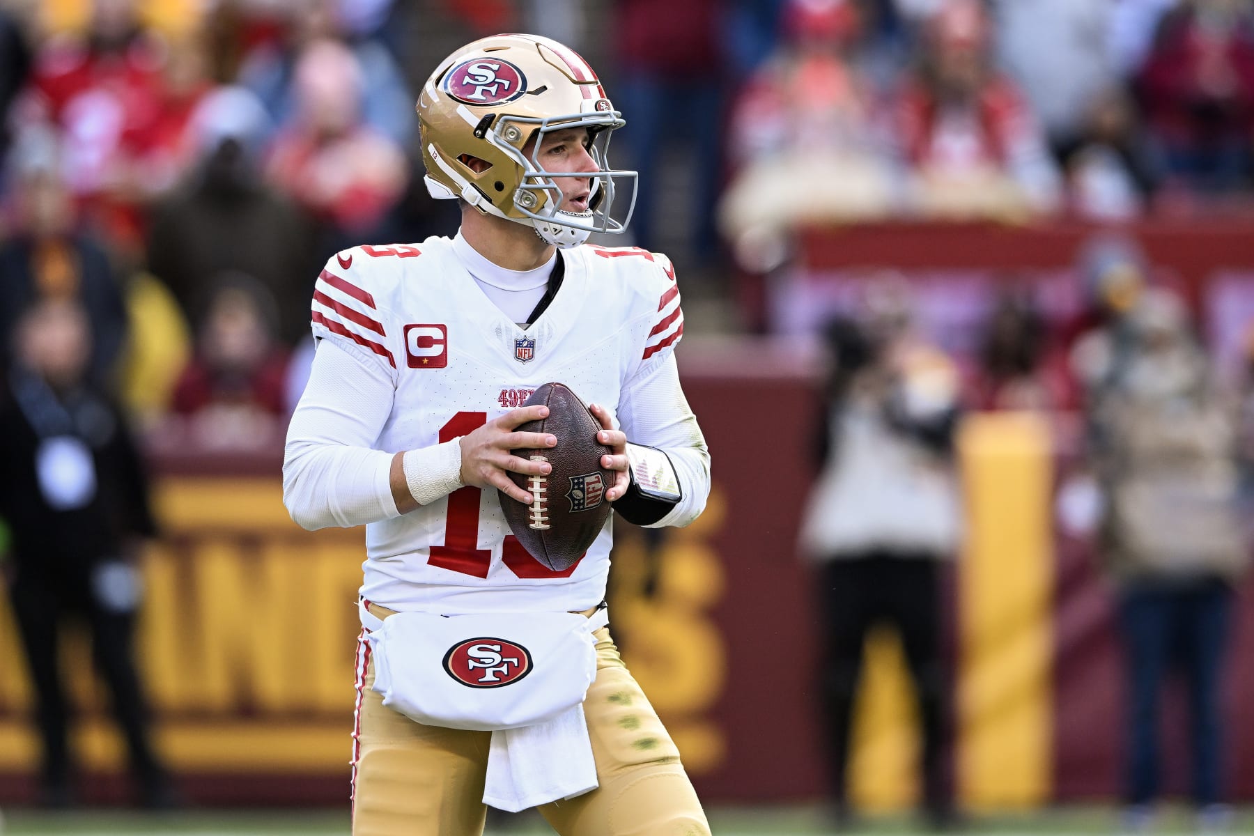 LANDOVER, MARYLAND - DECEMBER 31: Brock Purdy #13 of the San Francisco 49ers looks to pass during the second quarter of a game against the Washington Commanders at FedExField on December 31, 2023 in Landover, Maryland. (Photo by Greg Fiume/Getty Images)