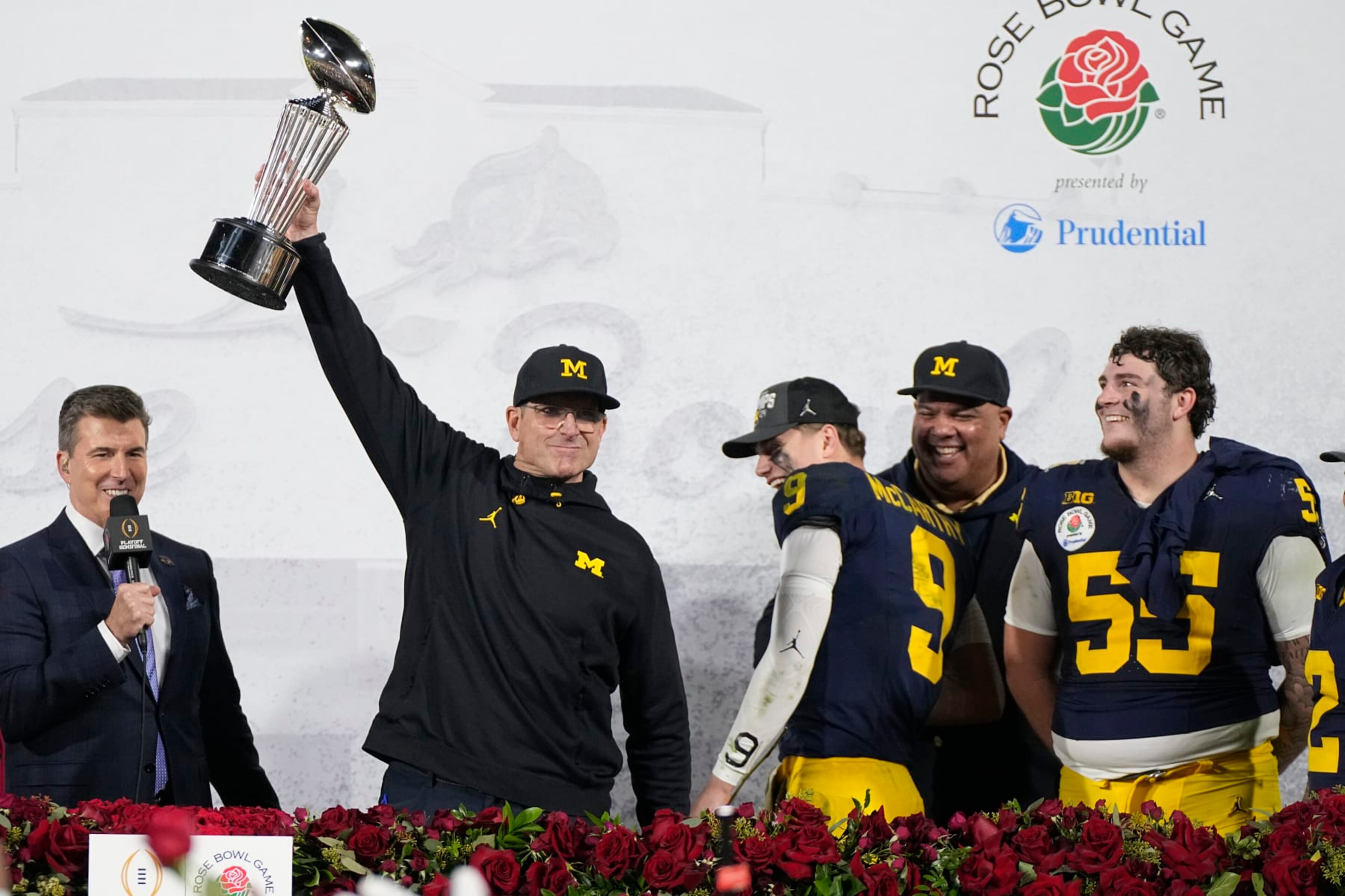 Michigan head coach Jim Harbaugh holds the winner's trophy after a win over Alabama in the Rose Bowl CFP NCAA semifinal college football game Monday, Jan. 1, 2024, in Pasadena, Calif. (AP Photo/Mark J. Terrill) Michigan head coach Jim Harbaugh holds the winner's trophy after a win over Alabama in the Rose Bowl CFP NCAA semifinal college football game Monday, Jan. 1, 2024, in Pasadena, Calif. (AP Photo/Mark J. Terrill)