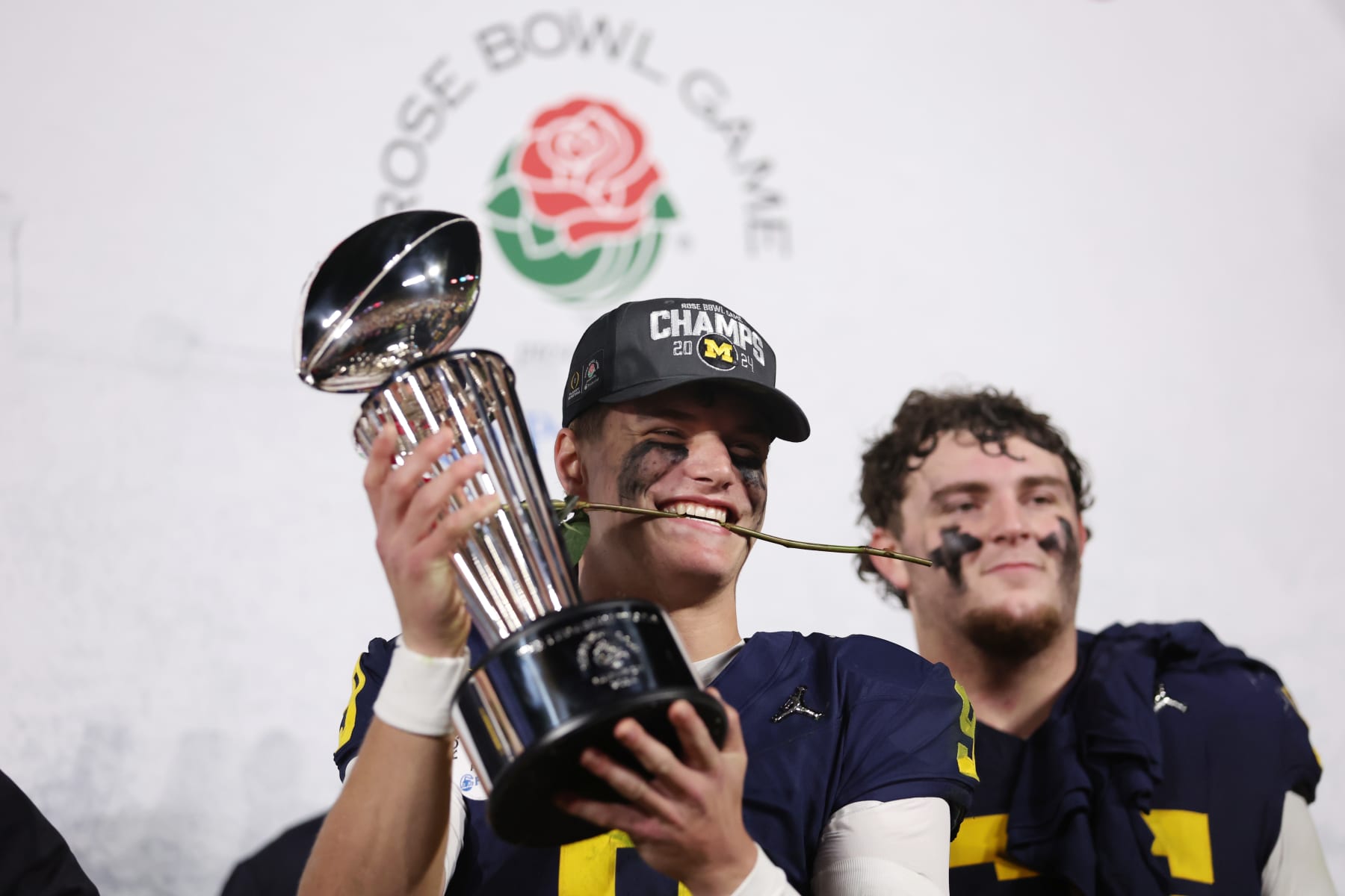 PASADENA, CALIFORNIA - JANUARY 01: J.J. McCarthy #9 of the Michigan Wolverines celebrates with The Leishman Trophy after beating the Alabama Crimson Tide 27-20 in overtime to win the CFP Semifinal Rose Bowl Game at Rose Bowl Stadium on January 01, 2024 in Pasadena, California. (Photo by Sean M. Haffey/Getty Images)