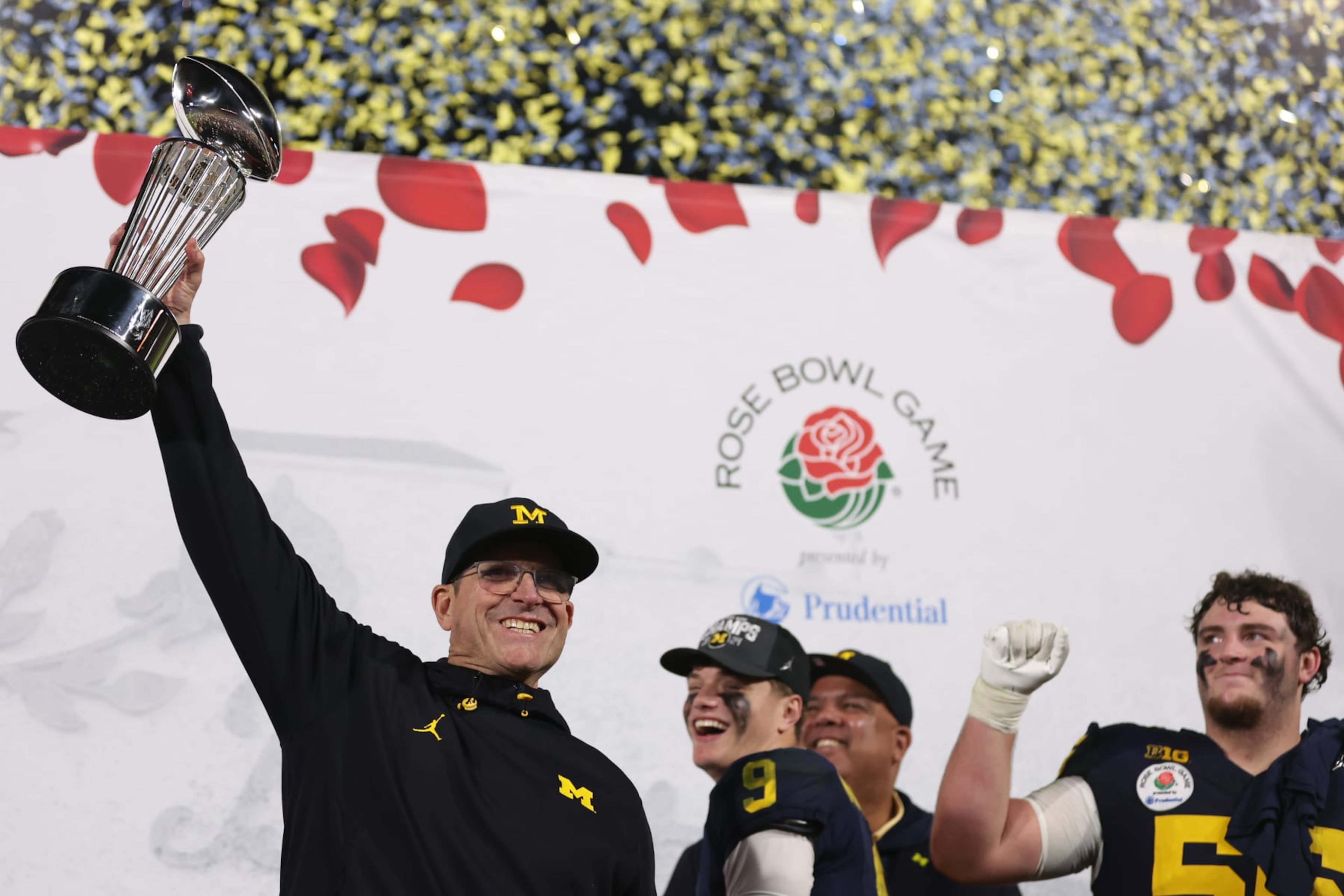 PASADENA, CALIFORNIA - JANUARY 01: Head coach Jim Harbaugh of the Michigan Wolverines celebrates with The Leishman Trophy after beating the Alabama Crimson Tide 27-20 in overtime to win the CFP Semifinal Rose Bowl Game at Rose Bowl Stadium on January 01, 2024 in Pasadena, California. (Photo by Sean M. Haffey/Getty Images)