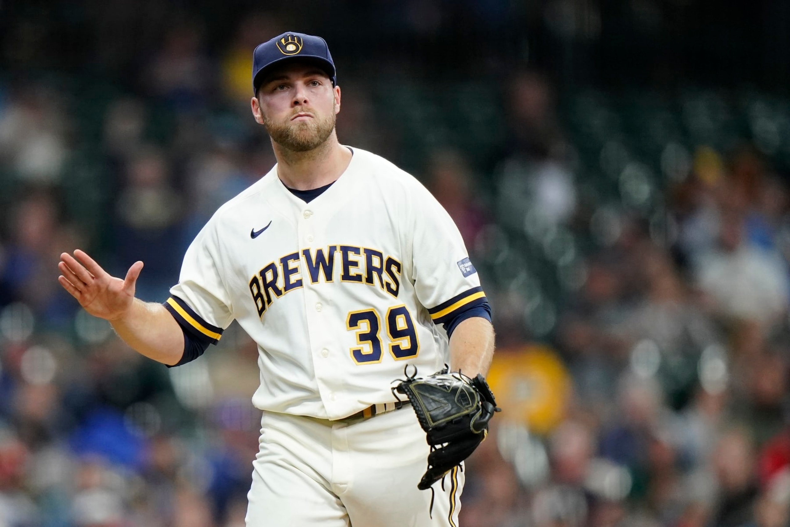 Milwaukee Brewers' Corbin Burnes reacts as he walks to the dugout during the fourth inning of a baseball game against the St. Louis Cardinals Thursday, Sept. 28, 2023, in Milwaukee. (AP Photo/Aaron Gash)