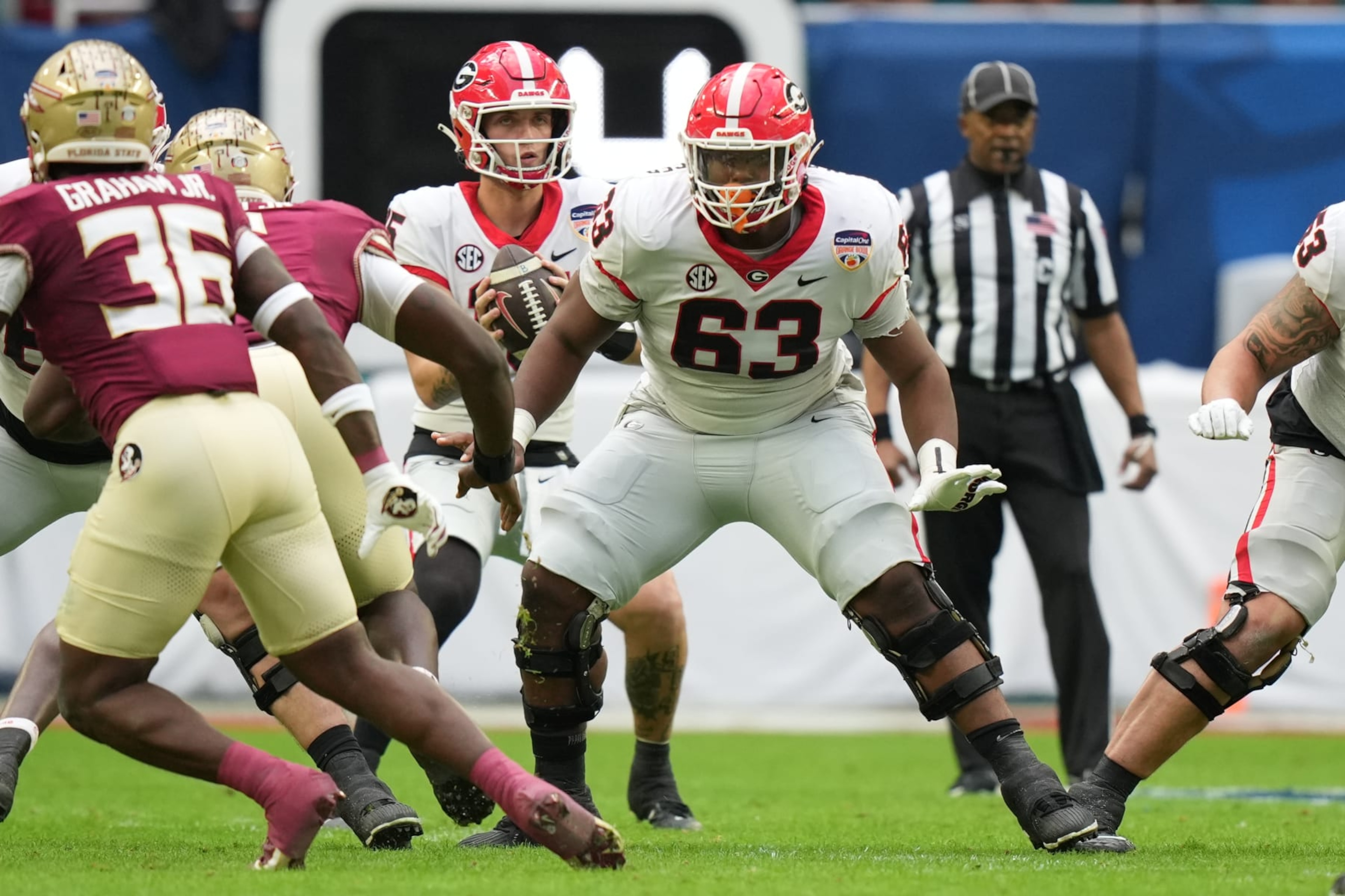 MIAMI GARDENS, FL - DECEMBER 30: Georgia Bulldogs offensive lineman Sedrick Van Pran (63) protects the pocket during the Capital One Orange Bowl game between the Georgia Bulldogs and the Florida State Seminoles on Saturday, December 30, 2023 at Hard Rock Stadium, Miami Gardens, Fla. (Photo by Peter Joneleit/Icon Sportswire via Getty Images) MIAMI GARDENS, FL - DECEMBER 30: Georgia Bulldogs offensive lineman Sedrick Van Pran (63) protects the pocket during the Capital One Orange Bowl game between the Georgia Bulldogs and the Florida State Seminoles on Saturday, December 30, 2023 at Hard Rock Stadium, Miami Gardens, Fla. (Photo by Peter Joneleit/Icon Sportswire via Getty Images)