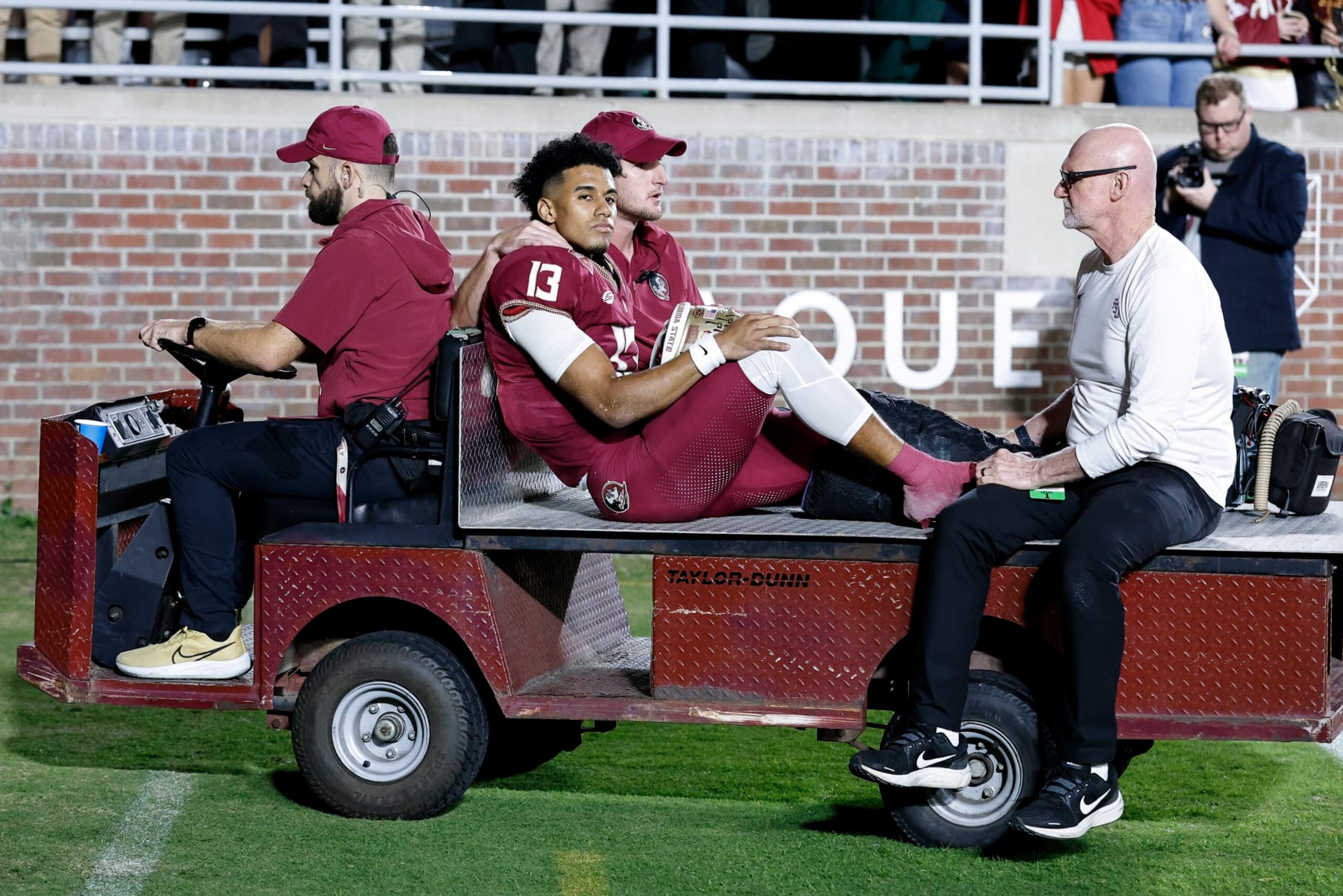 TALLAHASSEE, FL - NOVEMBER 18: Quarterback Jordan Travis #13 of the Florida State Seminoles is carted off the field after an ankle jury during the game against the North Alabama Lions on Bobby Bowden Field at Doak Campbell Stadium on November 18, 2023 in Tallahassee, Florida. The 4th ranked Seminoles defeated the Lions 58 to 13. (Photo by Don Juan Moore/Getty Images) TALLAHASSEE, FL - NOVEMBER 18: Quarterback Jordan Travis #13 of the Florida State Seminoles is carted off the field after an ankle jury during the game against the North Alabama Lions on Bobby Bowden Field at Doak Campbell Stadium on November 18, 2023 in Tallahassee, Florida. The 4th ranked Seminoles defeated the Lions 58 to 13. (Photo by Don Juan Moore/Getty Images)