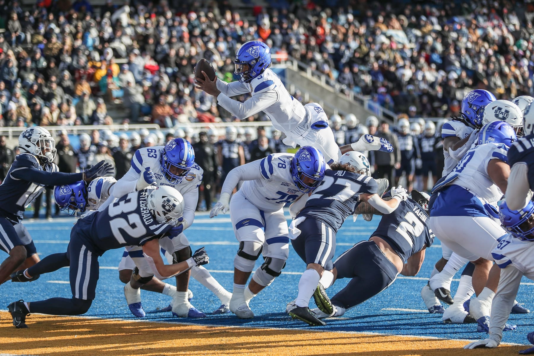 BOISE, ID - DECEMBER 23: Quarterback Darren Grainger #3 of the Georgia State Panthers soars into the endzone during the first half of the Famous Idaho Potato Bowl against the Utah State Aggies at Albertsons Stadium on December 23, 2023 in Boise, Idaho. (Photo by Loren Orr/Getty Images)
