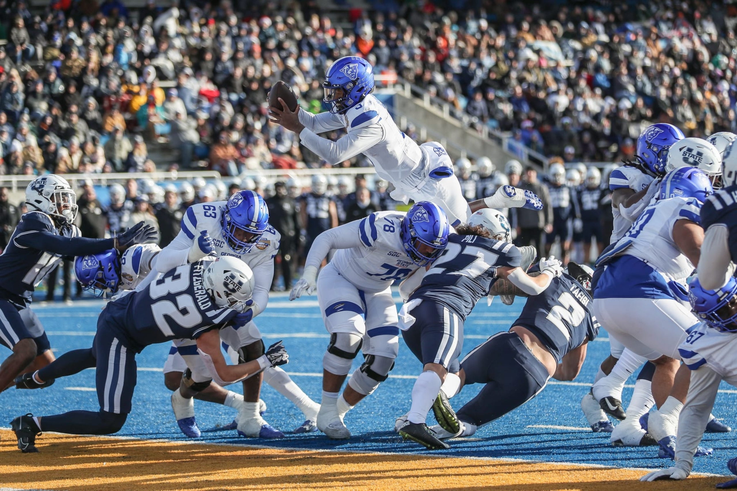 BOISE, ID - DECEMBER 23: Quarterback Darren Grainger #3 of the Georgia State Panthers soars into the endzone during the first half of the Famous Idaho Potato Bowl against the Utah State Aggies at Albertsons Stadium on December 23, 2023 in Boise, Idaho. (Photo by Loren Orr/Getty Images)