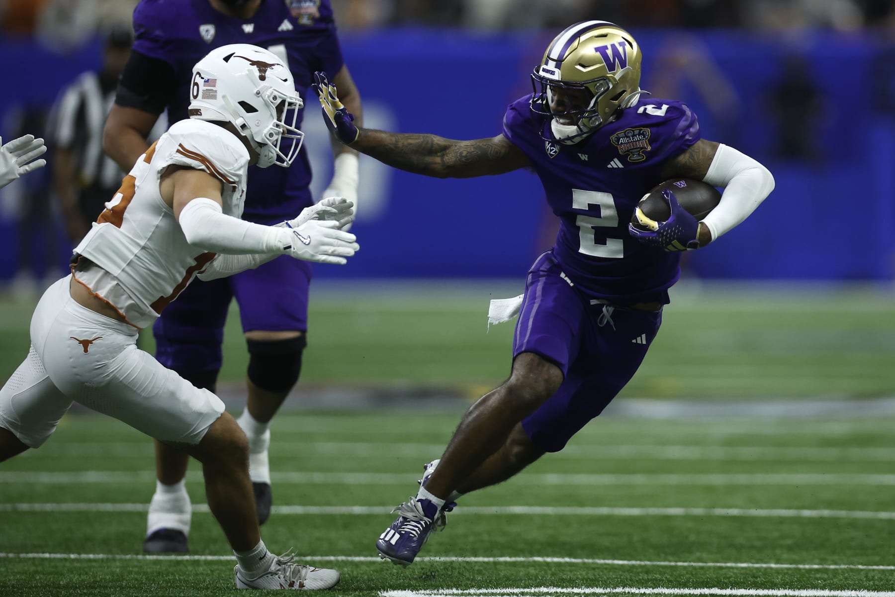 NEW ORLEANS, LOUISIANA - JANUARY 01: Ja'Lynn Polk #2 of the Washington Huskies runs with the ball during the third quarter against the Texas Longhorns during the CFP Semifinal Allstate Sugar Bowl at Caesars Superdome on January 01, 2024 in New Orleans, Louisiana. (Photo by Chris Graythen/Getty Images)