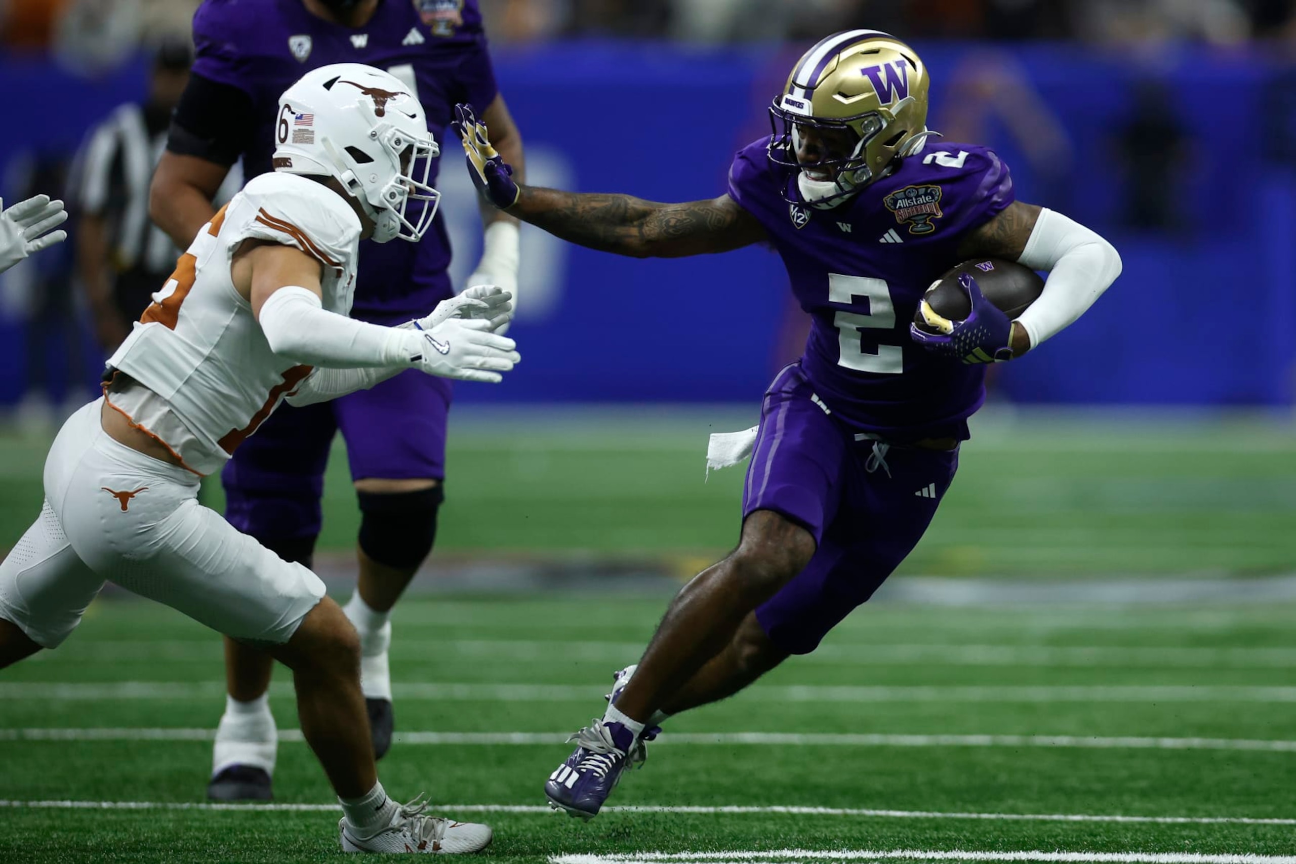 NEW ORLEANS, LOUISIANA - JANUARY 01: Ja'Lynn Polk #2 of the Washington Huskies runs with the ball during the third quarter against the Texas Longhorns during the CFP Semifinal Allstate Sugar Bowl at Caesars Superdome on January 01, 2024 in New Orleans, Louisiana. (Photo by Chris Graythen/Getty Images)