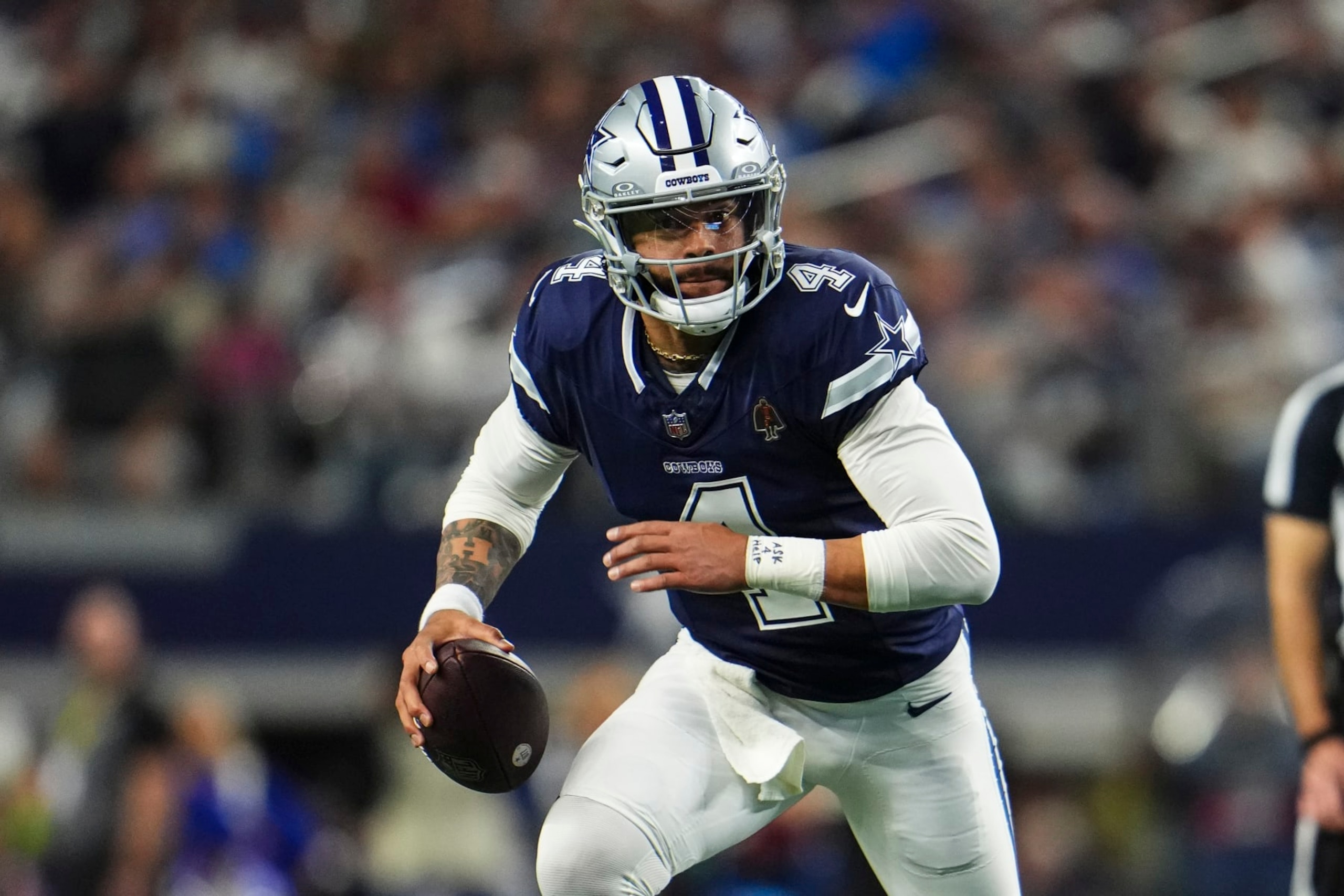 ARLINGTON, TX - DECEMBER 30: Dak Prescott #4 of the Dallas Cowboys scrambles out of the pocket during an NFL football game against the Detroit Lions at AT&T Stadium on December 30, 2023 in Arlington, Texas. (Photo by Cooper Neill/Getty Images)
