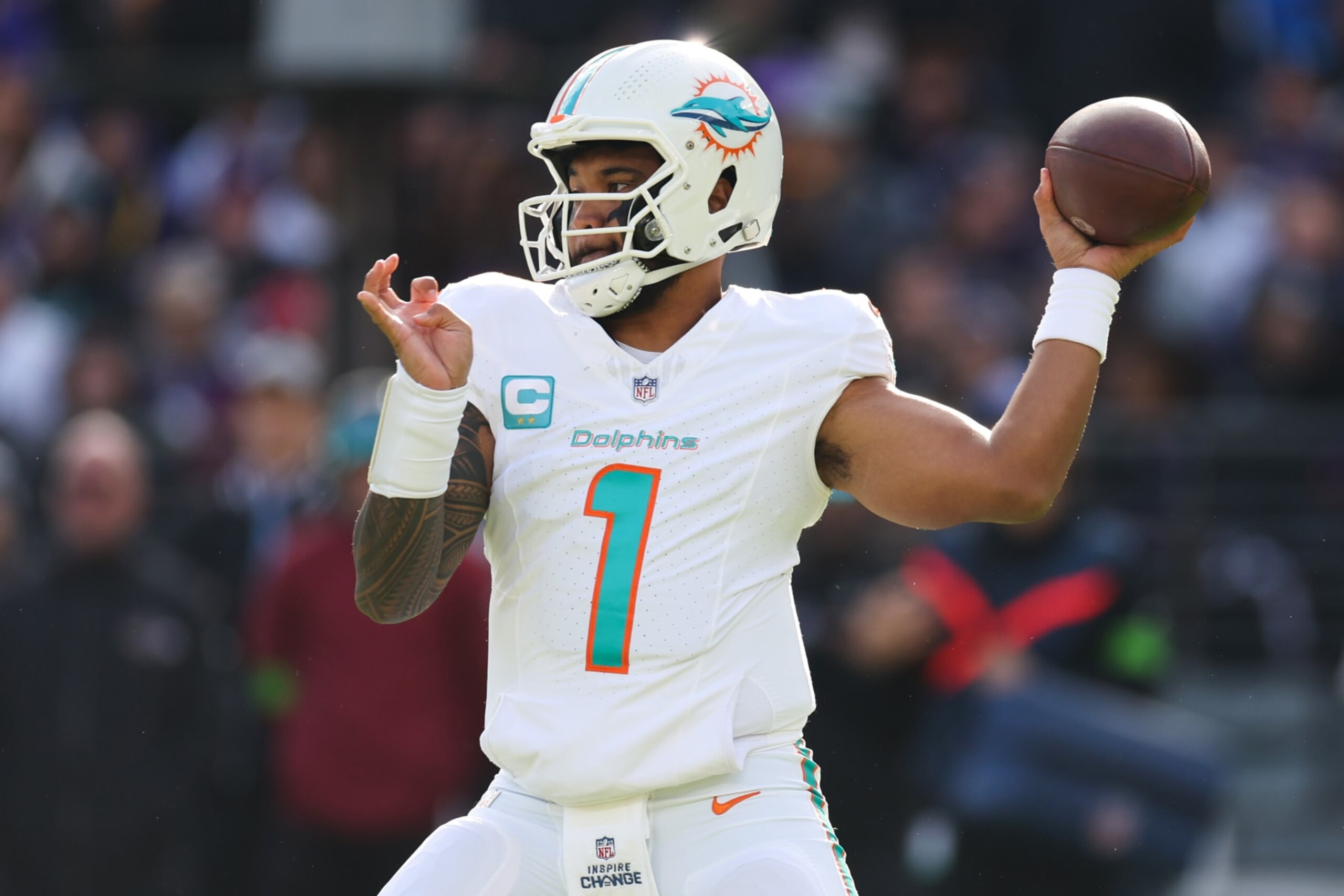 BALTIMORE, MARYLAND - DECEMBER 31: Tua Tagovailoa #1 of the Miami Dolphins throws a pass against the Baltimore Ravens during the first half of the game at M&T Bank Stadium on December 31, 2023 in Baltimore, Maryland. (Photo by Rob Carr/Getty Images)