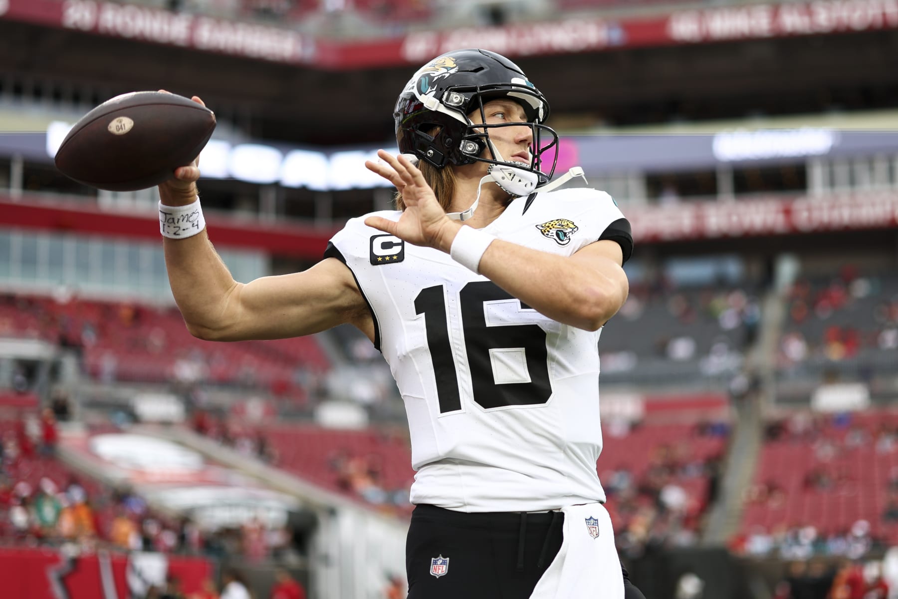 TAMPA, FL - DECEMBER 24: Trevor Lawrence #16 of the Jacksonville Jaguars warms up prior to an NFL football game against the Tampa Bay Buccaneers at Raymond James Stadium on December 24, 2023 in Tampa, Florida. (Photo by Kevin Sabitus/Getty Images)